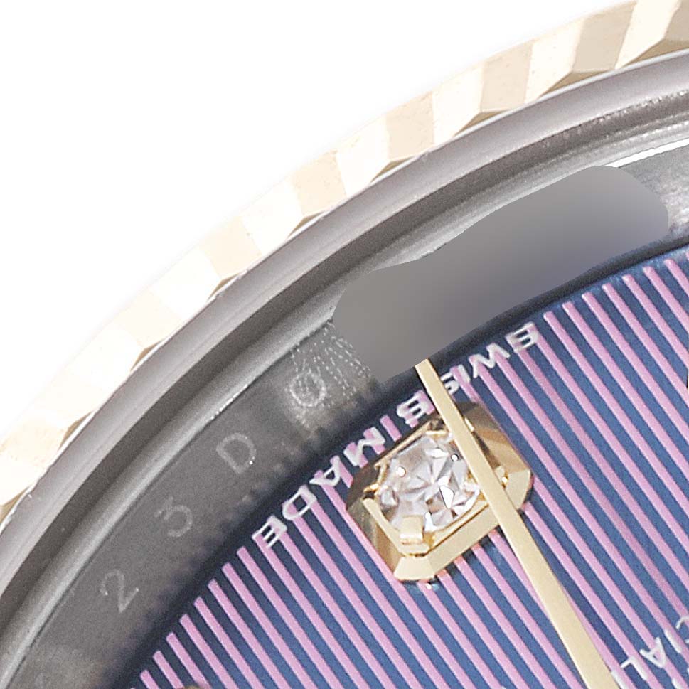 This close-up shows the dial, fluted bezel, and diamond hour marker of a Rolex Datejust 279173 Women's Steel and Gold (two tone) Purple Dial 279173 Women's Steel and Gold (two tone) Purple Dial watch.