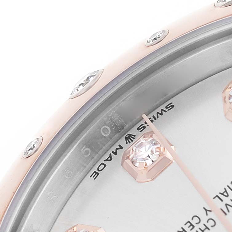 The image shows a close-up of the bezel and part of the dial of a Rolex Mid-Size 278341 Women's Steel and Gold (two tone) Silver Dial watch, highlighting the diamonds and "Swiss Made" text.