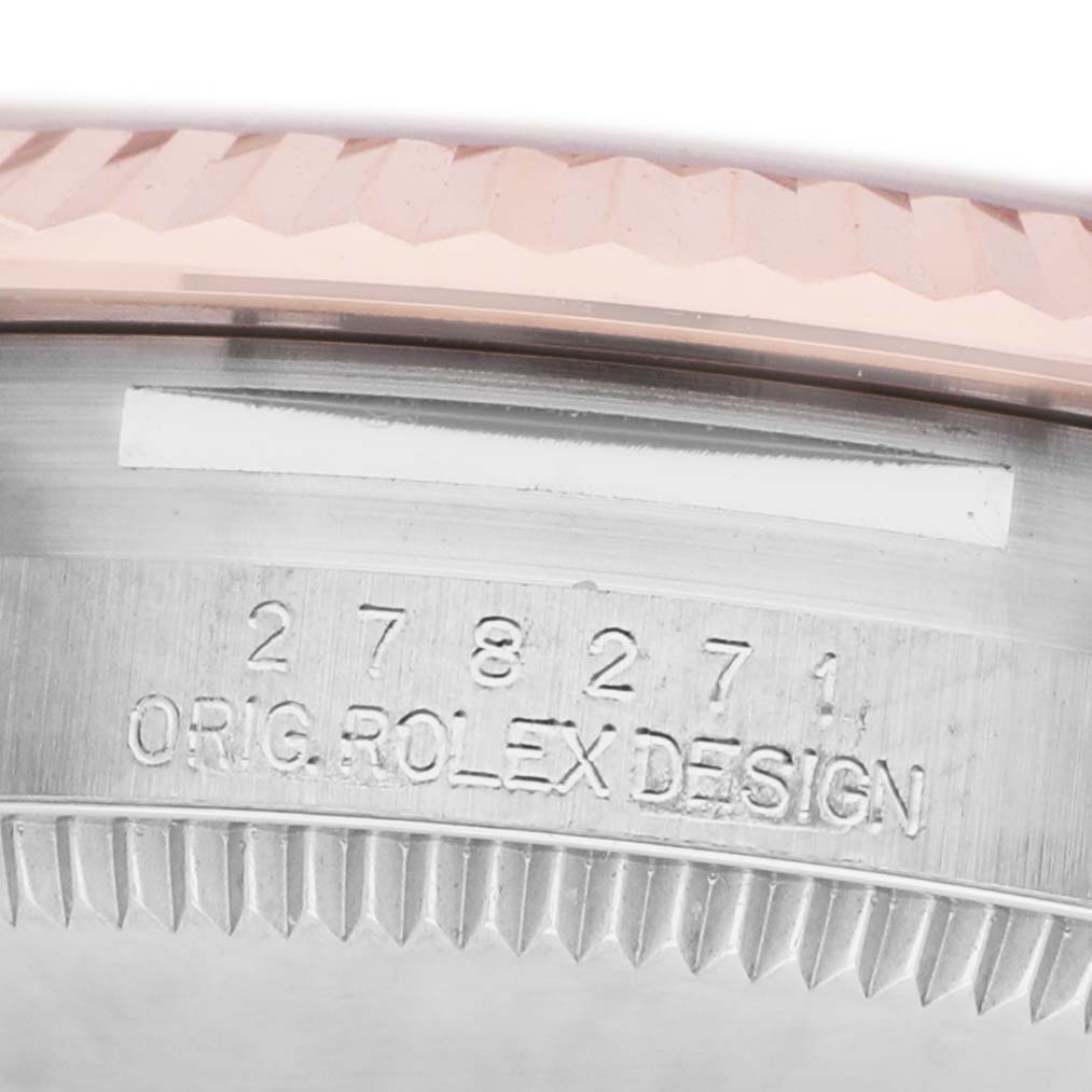 The image shows a close-up angle of the case side and bezel of a Mid-Size Rolex watch, featuring the engraved model number and "ORIG. ROLEX DESIGN" text.