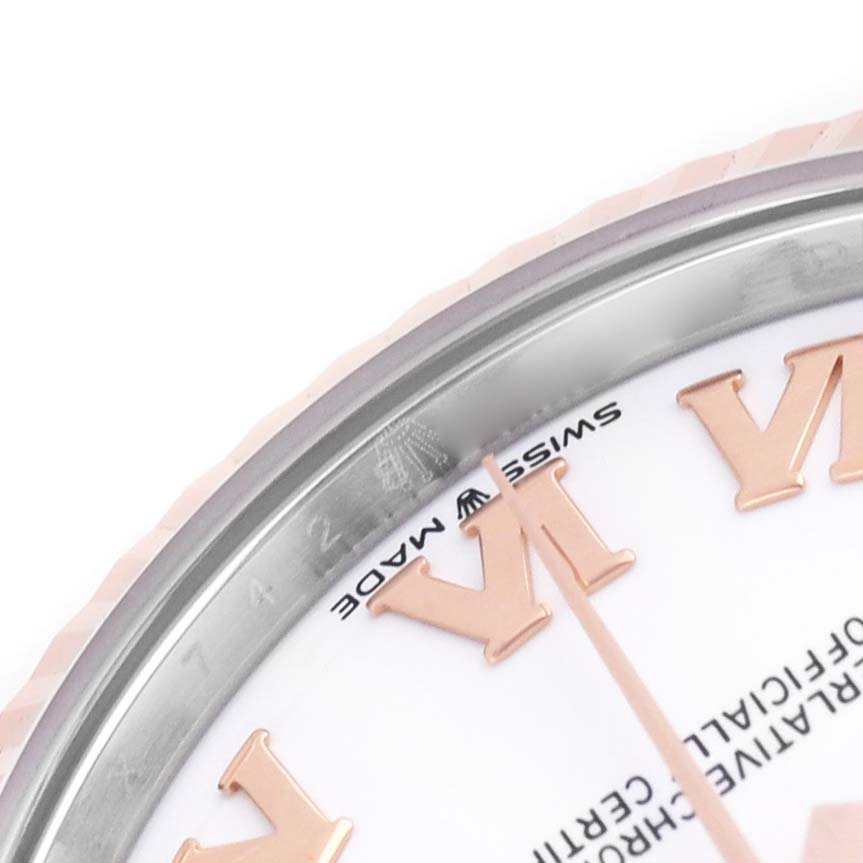 The image shows a close-up of the Rolex Mid-Size 278271 Women's Rose Gold White Dial watch face, highlighting the bezel and Roman numeral markers.