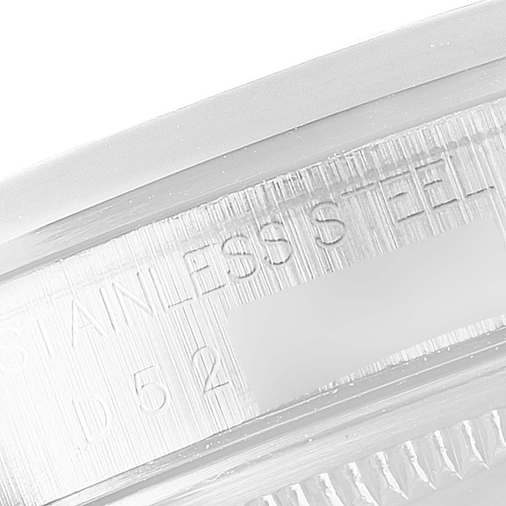 The image shows a close-up of the engraved stainless steel text on the inner bezel of a Rolex Datejust 16200 Men's Stainless Steel Silver Dial 16200 Men's Stainless Steel Silver Dial watch.