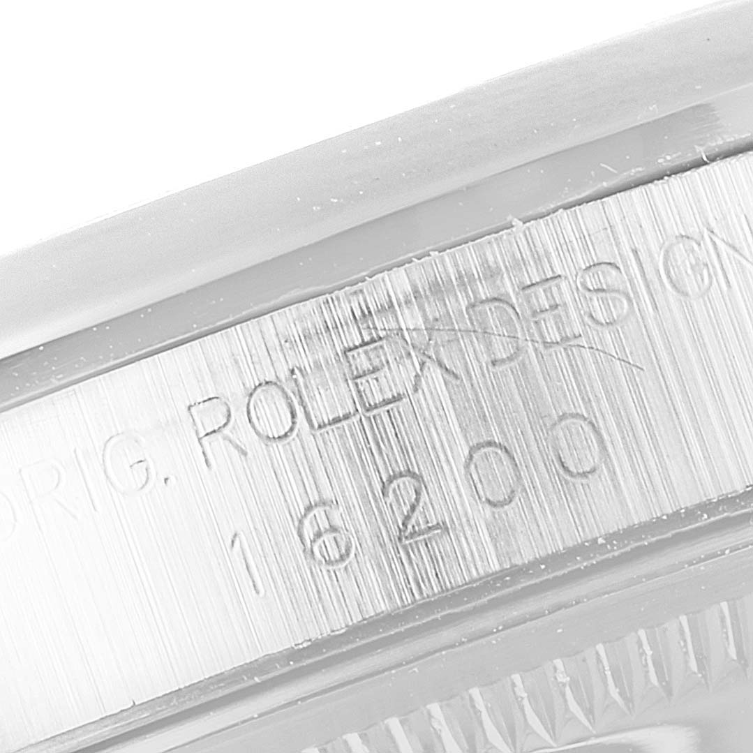 This image shows a close-up of the engraved case of a Rolex Datejust 16200 Men's Stainless Steel Silver Dial 16200 Men's Stainless Steel Silver Dial 16200 model.