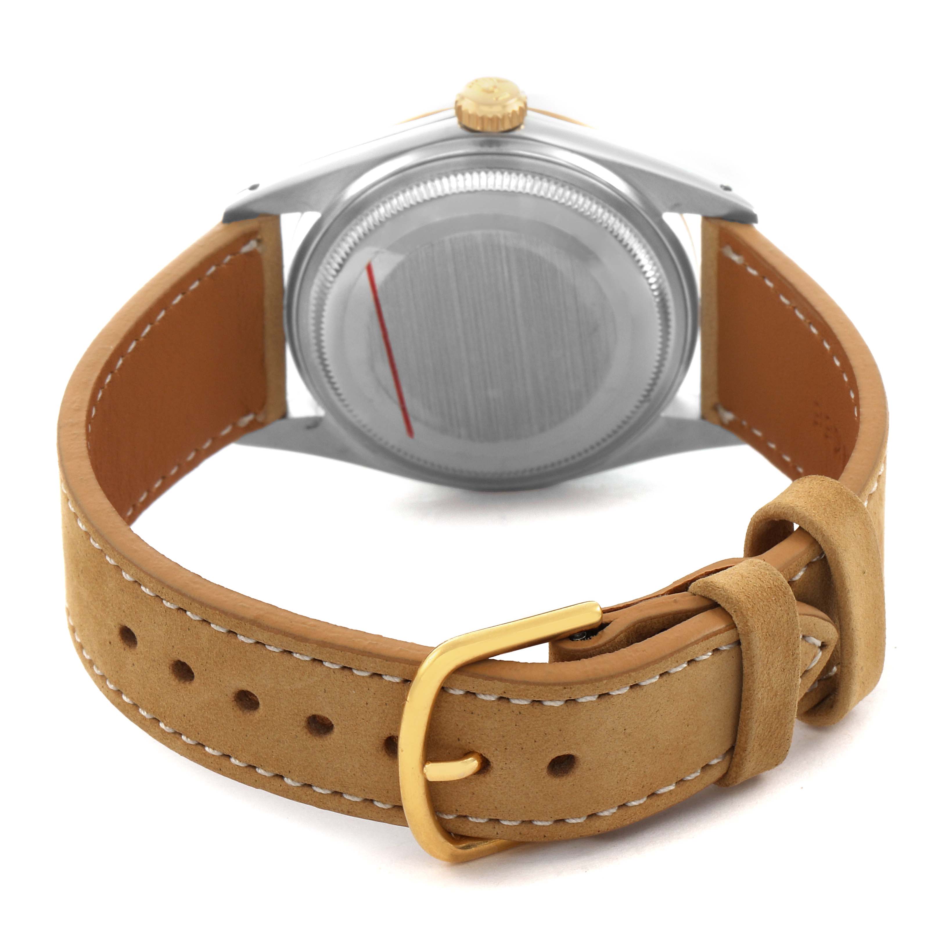 The Rolex Vintage Collection 16013 Men's Steel and Gold (two tone) Champagne Dial watch is shown from the back, displaying the case back and tan leather strap with a buckle.