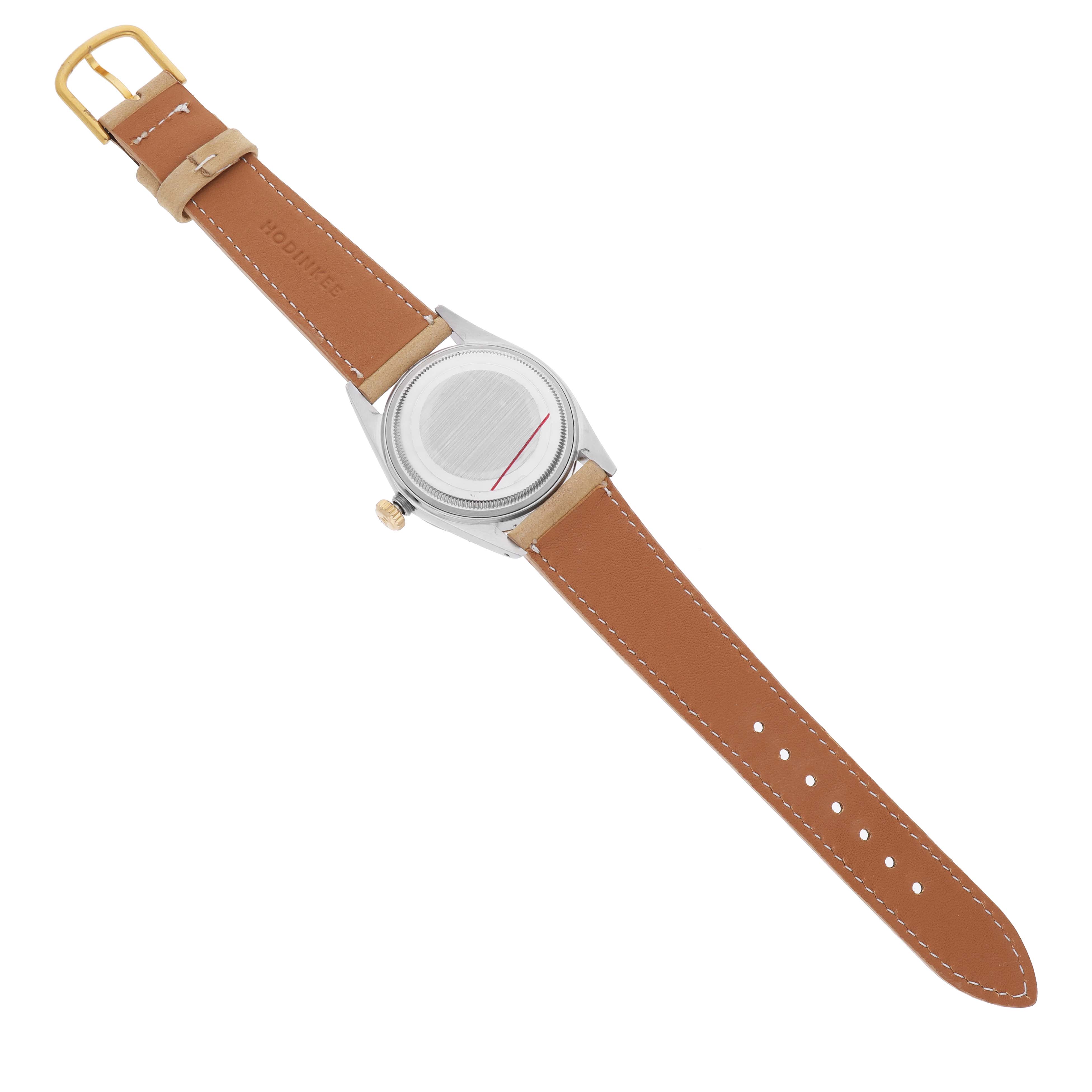The image shows the underside of a Rolex Vintage Collection 16013 Men's Steel and Gold (two tone) Champagne Dial watch, highlighting the case back, crown, and brown leather strap.