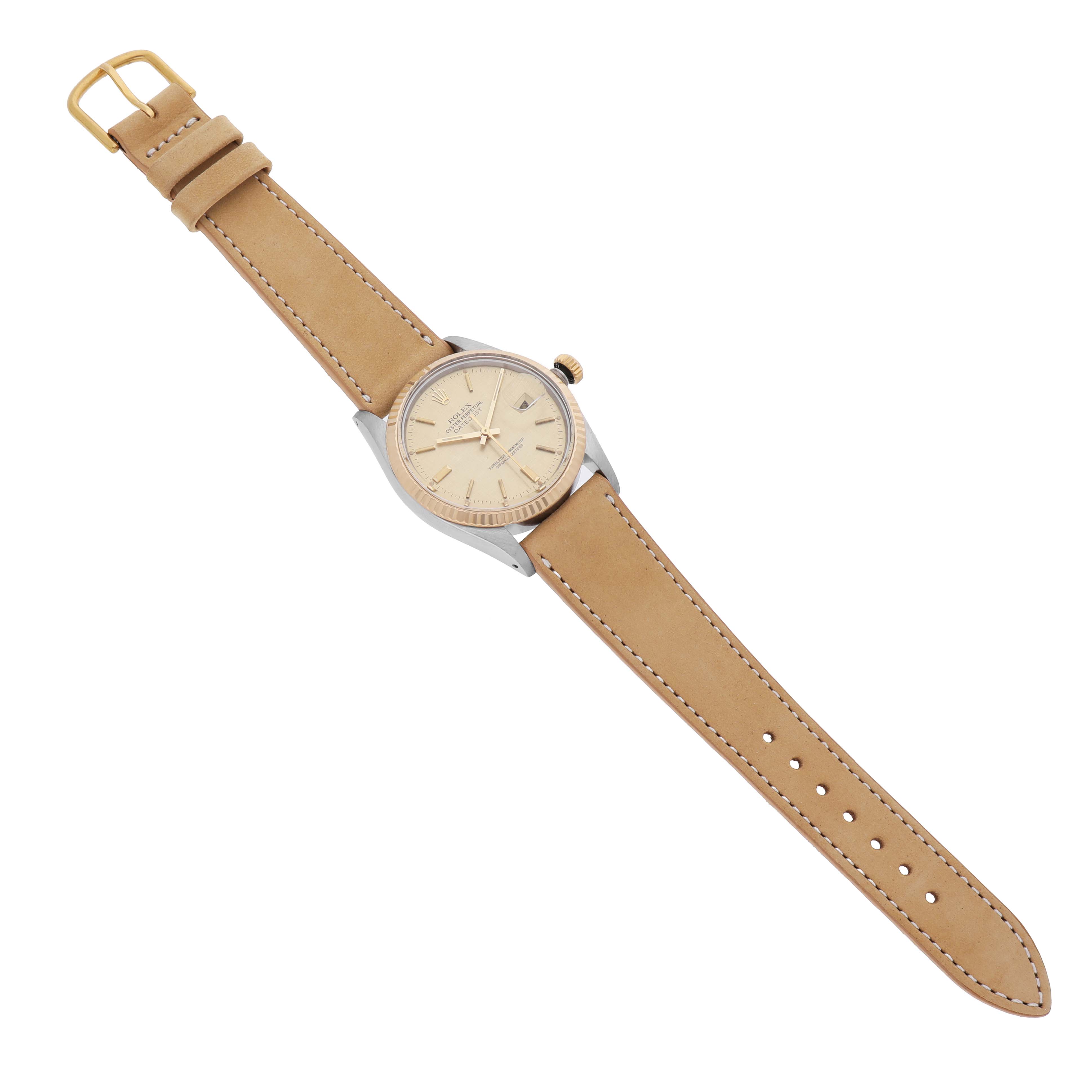 The Rolex Vintage Collection 16013 Men's Steel and Gold (two tone) Champagne Dial watch is shown from a top angle, highlighting its face, bezel, crown, and tan strap with buckle.
