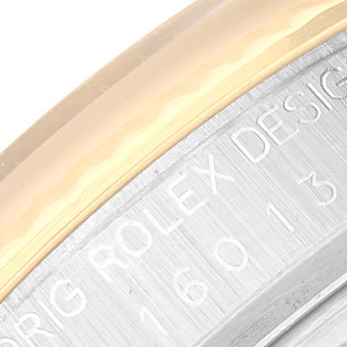 The image shows a close-up of the serial number engraving on the side of a Rolex Vintage Collection 16013 Men's Steel and Gold (two tone) Black Dial 16013 Men's Steel and Gold (two tone) Black Dial watch.