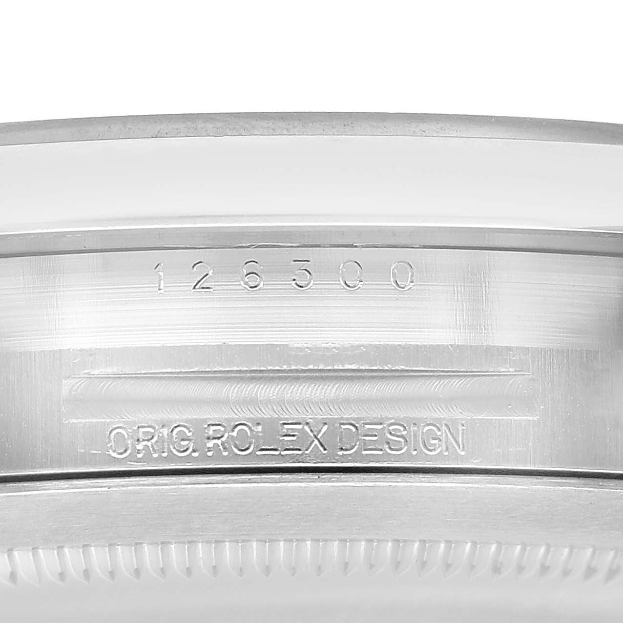 This image shows a close-up of the case side engraving on a Rolex Datejust 41 126300 Men's Stainless Steel Blue Dial, featuring its model number and design inscription.