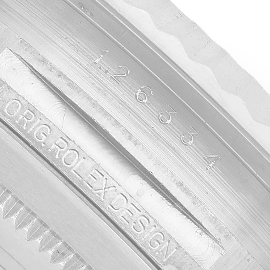 The image shows a close-up of the inner bezel engraving on a Rolex Datejust 41 126334 Men's White Gold Black Dial, displaying the model number and "Orig Rolex Design".