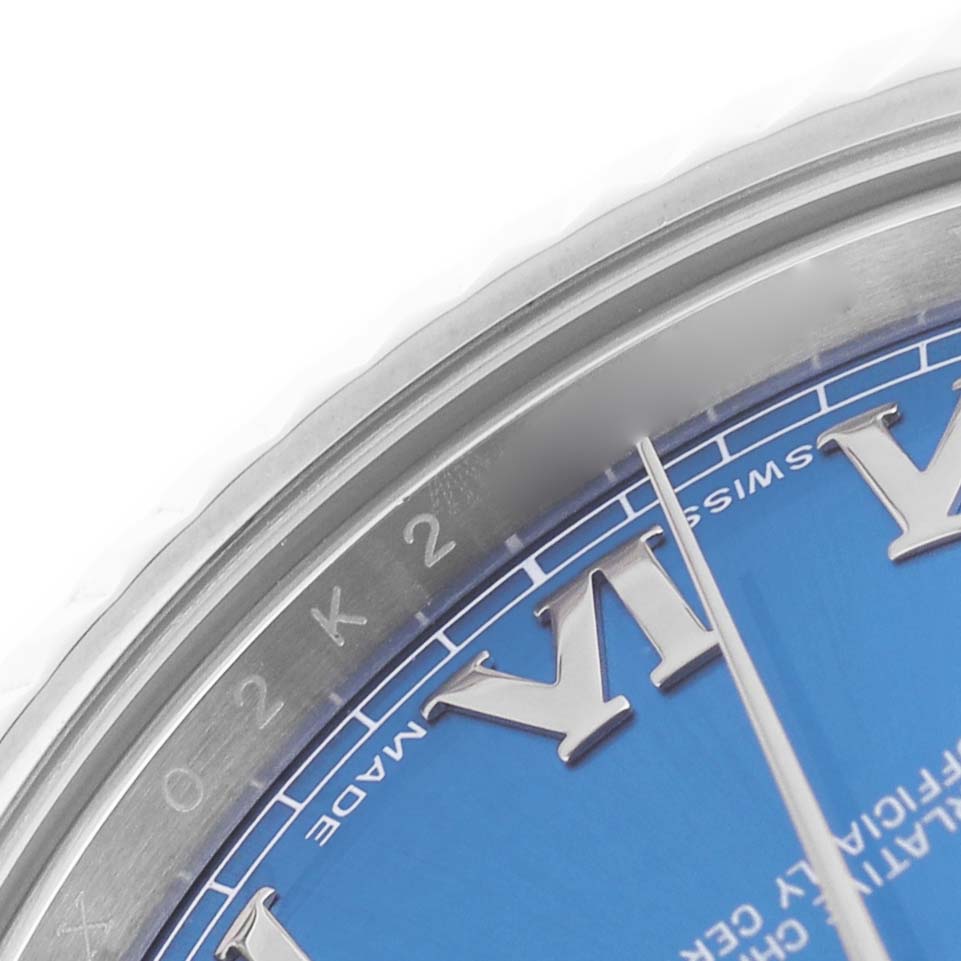 The image shows a close-up of the Rolex Datejust 41 116334 Men's Stainless Steel Blue Dial's blue dial, focusing on the Roman numeral markers and the watch's bezel.