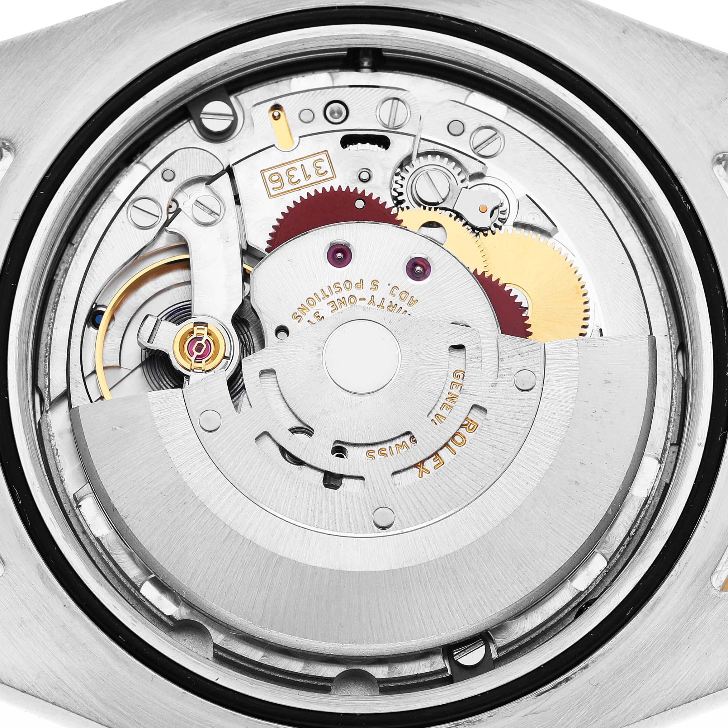 This image shows a detailed view of the movement inside the Rolex Datejust 41 116333 Men's Steel and Gold (two tone) Black Dial, highlighting gears and components.