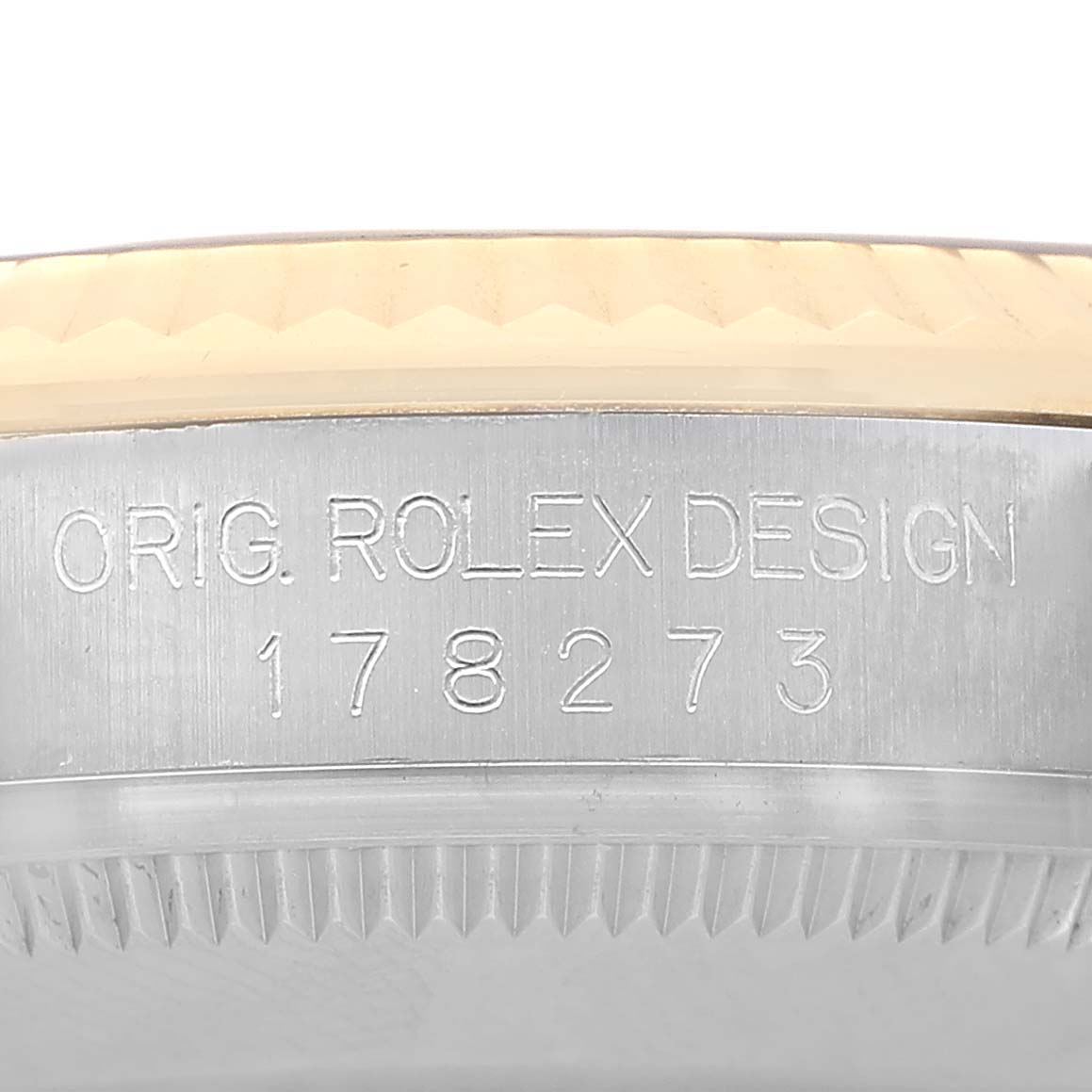 The image shows a close-up of the case side of a Rolex Mid-Size 178273 Women's Steel and Gold (two tone) Black Dial model, highlighting the model number engraving.