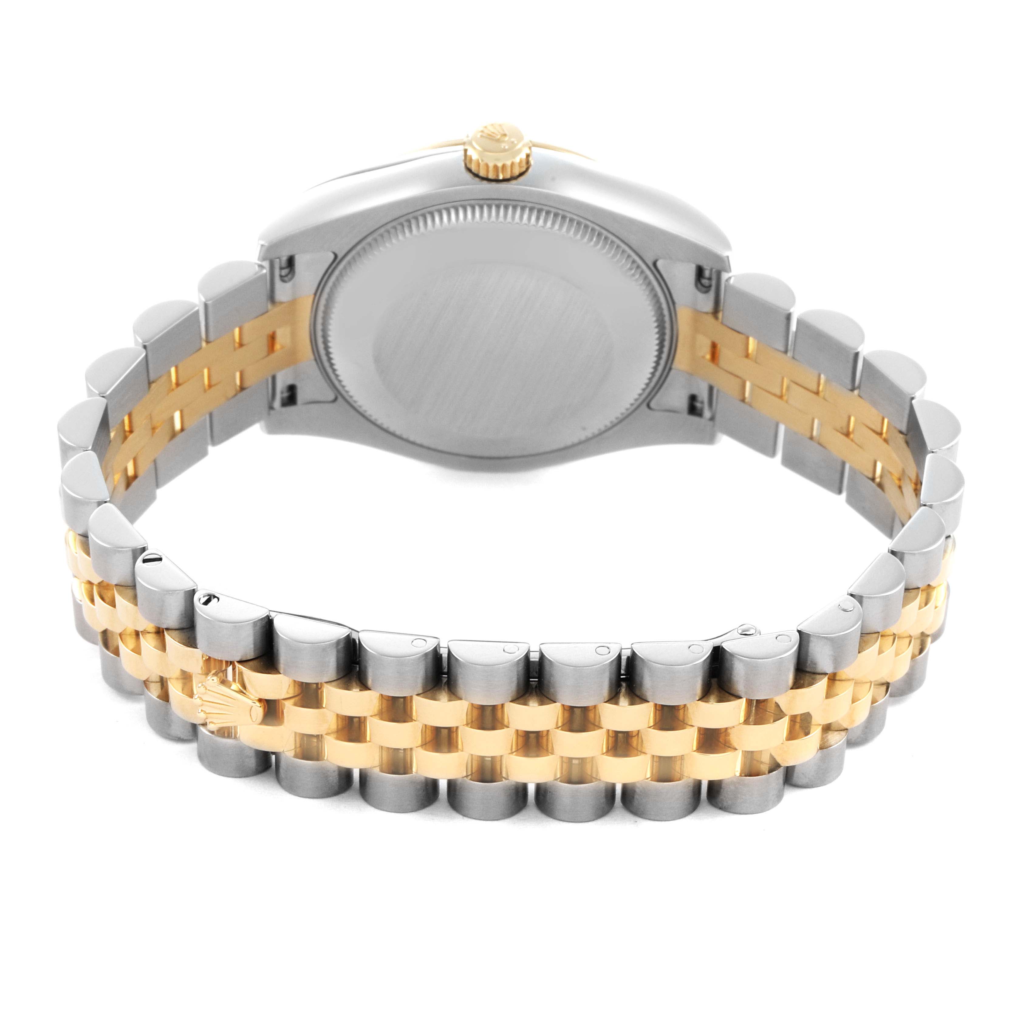The Rolex Mid-Size 178273 Women's Steel and Gold (two tone) Black Dial watch is shown from the back, featuring the case back and two-tone metal bracelet with a gold and silver finish.