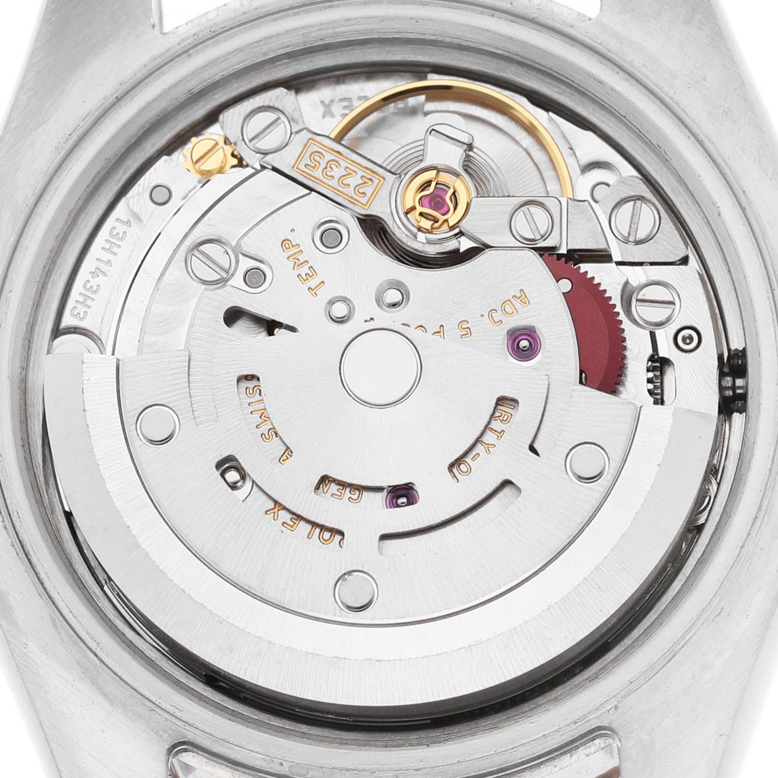 The image shows the movement of a Rolex Datejust 179171 Women's Steel and Gold (two tone) Silver Dial, featuring gears and components of the inner mechanism from a top-down angle.