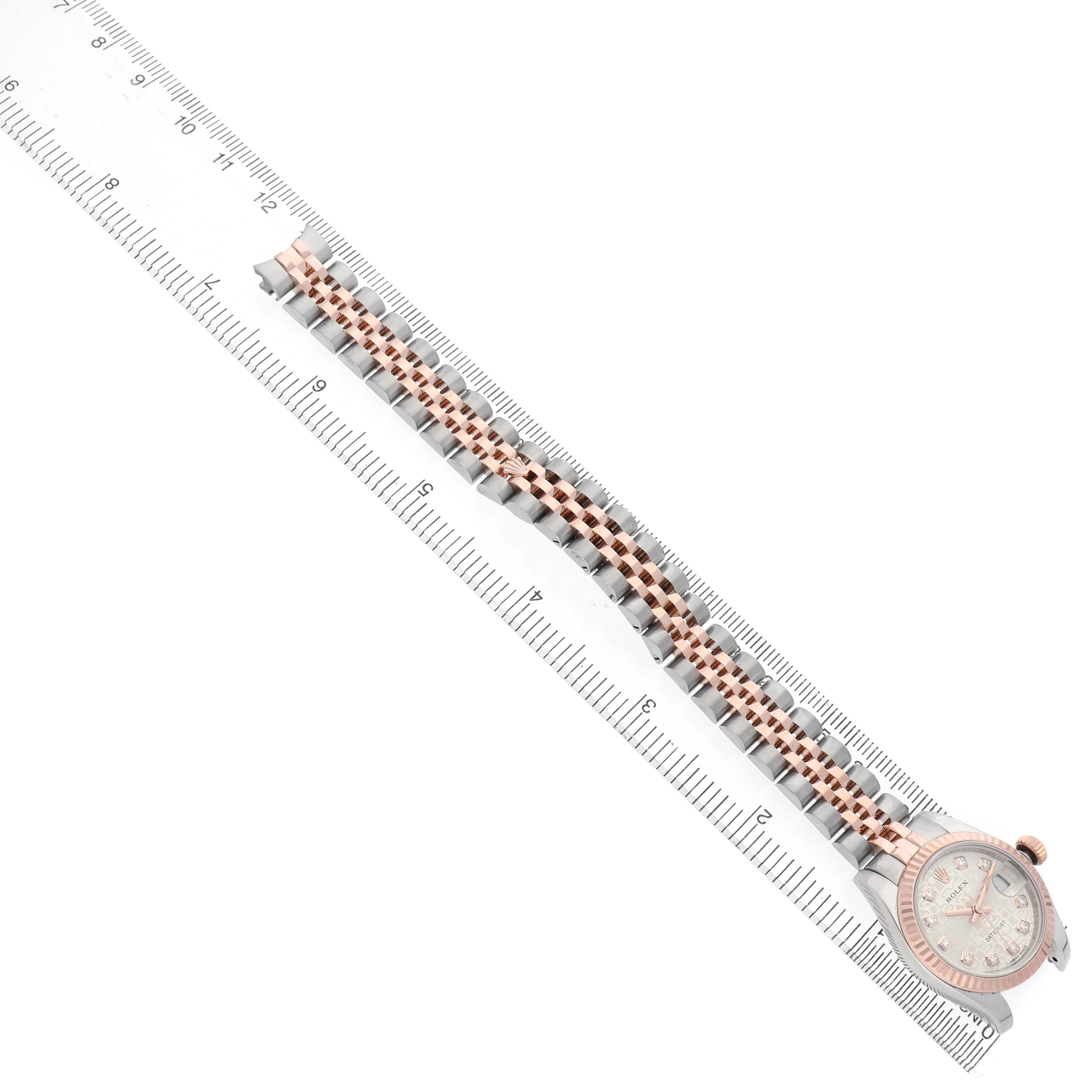 The Rolex Datejust 179171 Women's Steel and Gold (two tone) Silver Dial watch is shown from a top-down angle, highlighting its bracelet and dial.