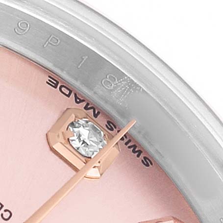 The image shows a close-up of the Rolex Datejust 179161 Women's Steel and Gold (two tone) Pink Dial dial, highlighting a portion of the index with a diamond.