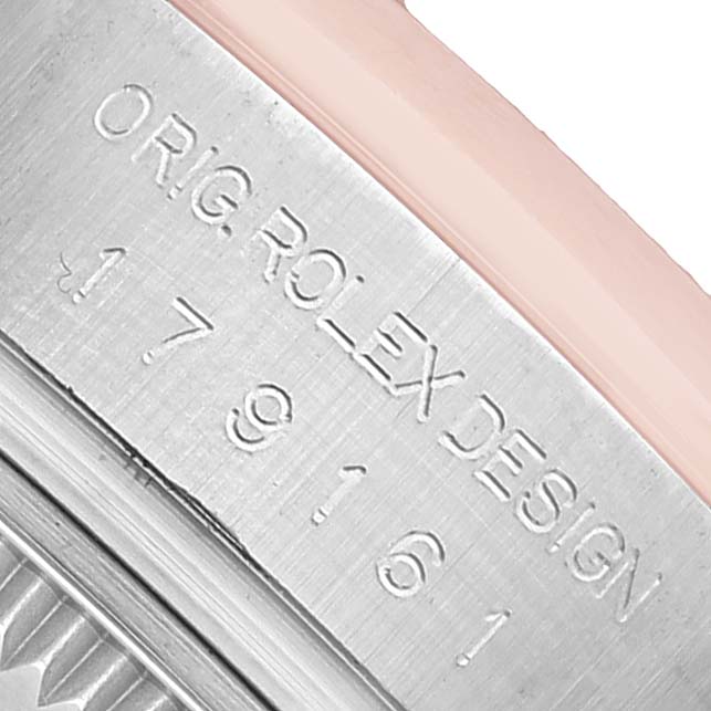 The image shows a close-up angle of the Rolex Datejust 179161 Women's Steel and Gold (two tone) Pink Dial's case side with the engraved model details.