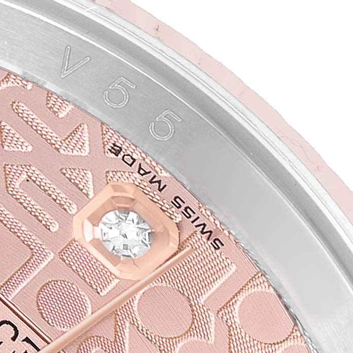 The image shows a close-up of a Rolex Datejust 116231 Men's Steel and Gold (two tone) Pink Dial watch dial, highlighting the "SWISS MADE" text, textured pattern, and bezel markings.