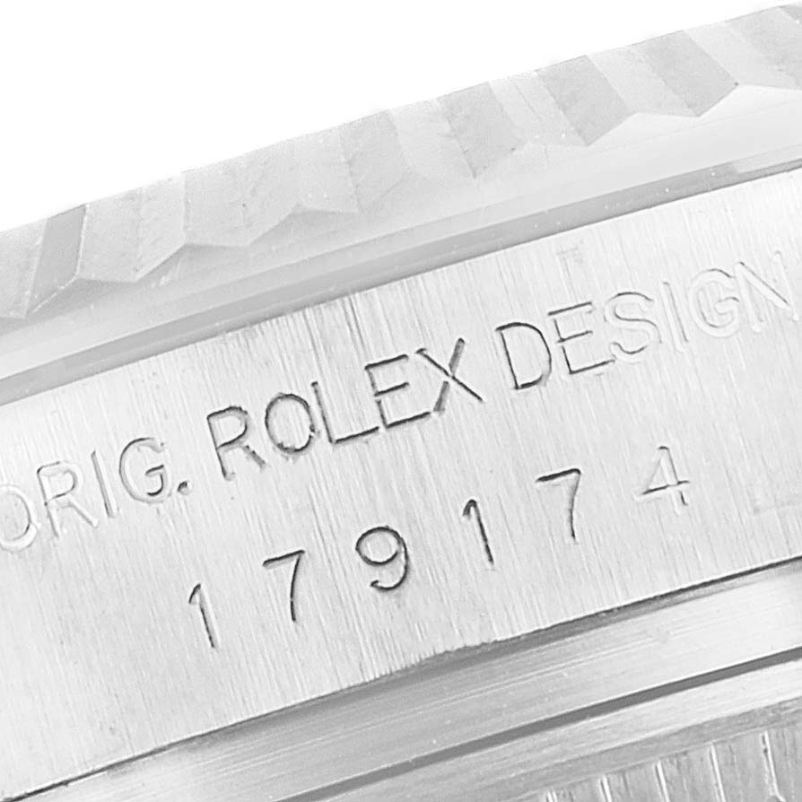 This image shows a close-up of the case side with the serial number and "ROLEX DESIGN" engraving on a Rolex Datejust 179174 Women
s Stainless Steel Silver Dial 179174 Women
s Stainless Steel Silver Dial watch.