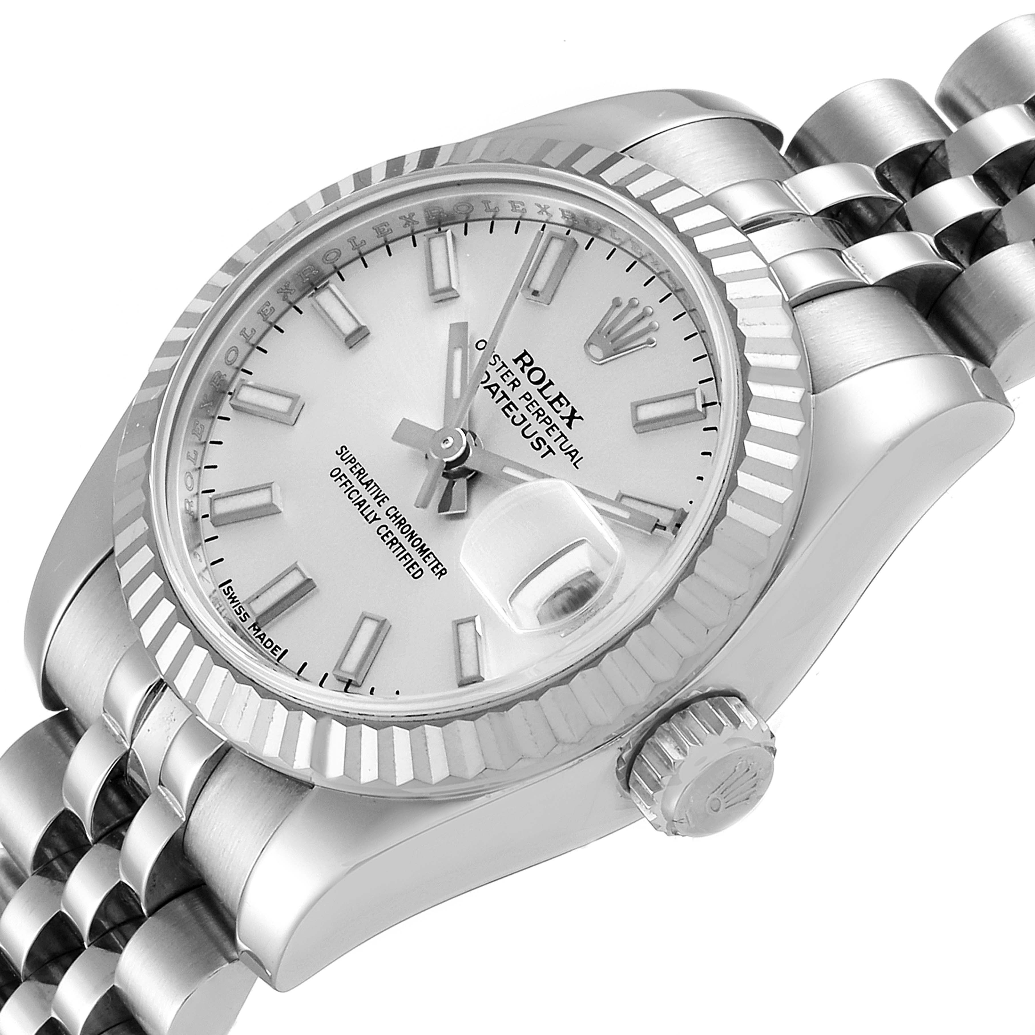 The image shows a Rolex Datejust 179174 Women
s Stainless Steel Silver Dial 179174 Women
s Stainless Steel Silver Dial watch at an angle highlighting its dial, fluted bezel, crown, and part of its jubilee bracelet.