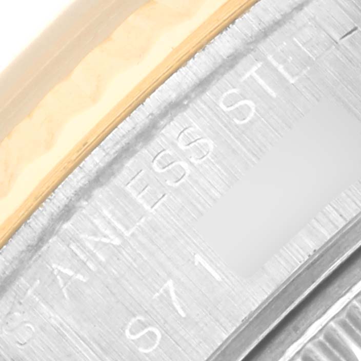 Close-up of the side of the Rolex Datejust 69173 Women's Steel and Gold (two tone) Black Dial 69173 Women's Steel and Gold (two tone) Black Dial watch, showing the 'stainless steel' engraving.