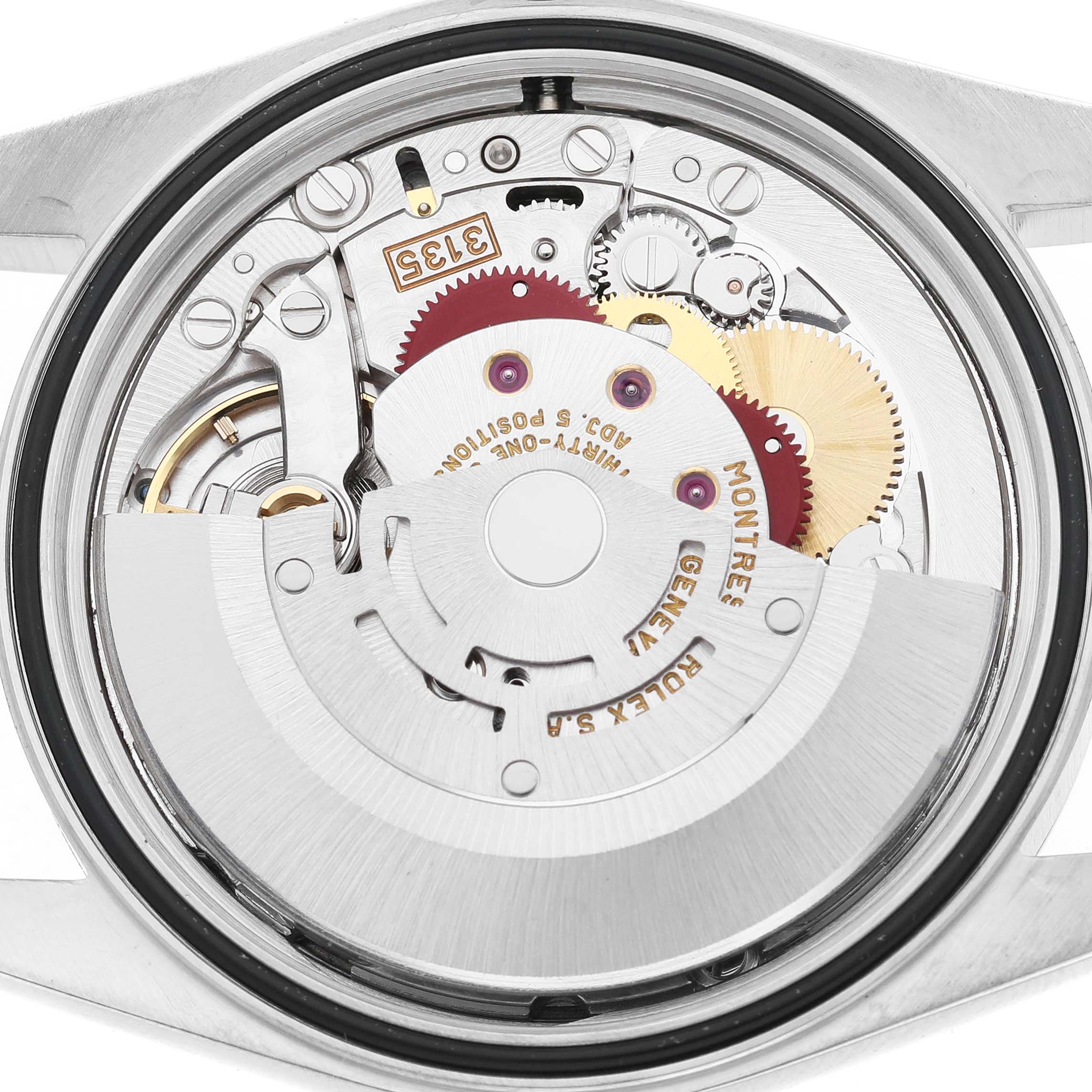 The image shows the movement from the back of the Rolex Datejust 16233 Men's Stainless Steel Champagne Dial, highlighting its intricate gears and rotor.
