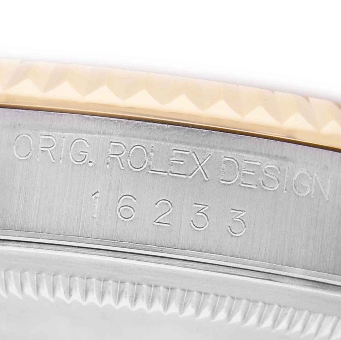 The image shows a close-up of the case side of a Rolex Datejust 16233 Men's Stainless Steel Champagne Dial, highlighting the engraved model number and bezel edge.
