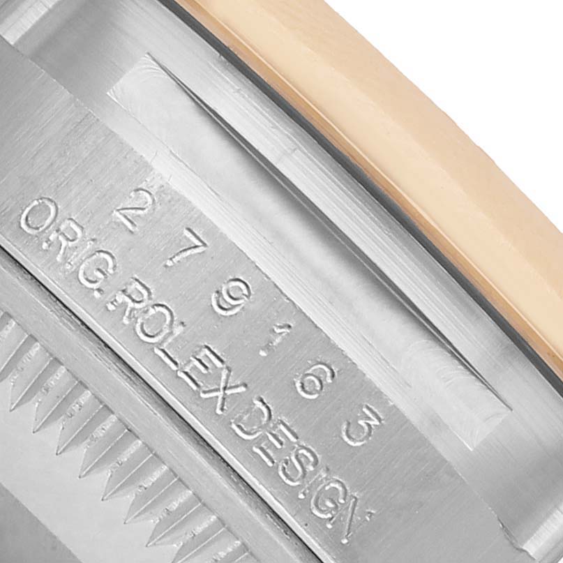 The image shows a close-up of the model number and "ORIG. ROLEX DESIGN" engraving on a Rolex Datejust 279163 Women's Steel and Gold (two tone) Green Dial watch bezel.