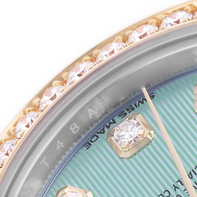 The image shows a close-up of a Rolex Datejust 279383 Women's Steel and Gold (two tone) Green Dial watch with a jeweled bezel and part of the dial with diamond markers.