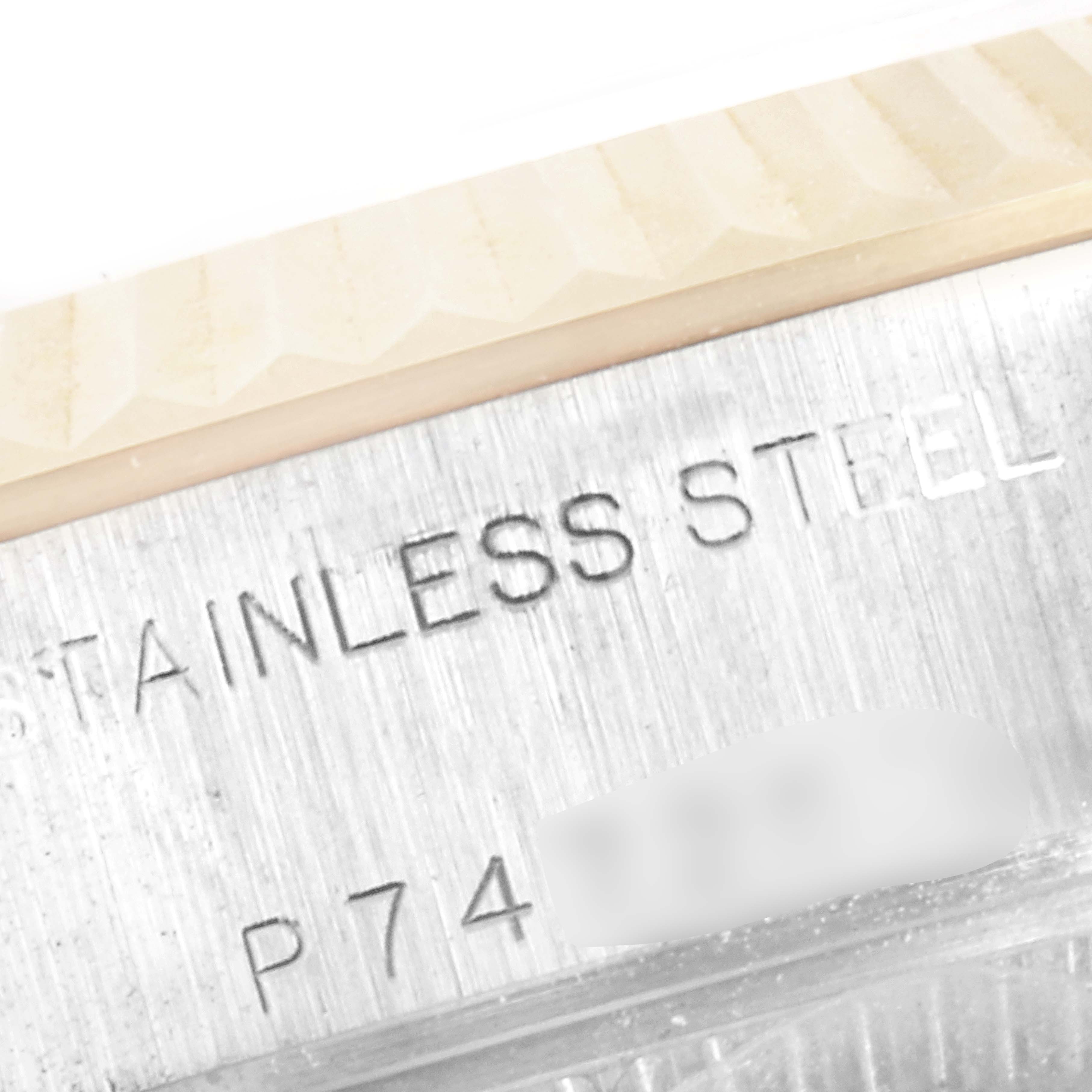 The image shows a close-up of the side of a Rolex Datejust 79173 Women
s Steel and Gold (two tone) Silver Dial 79173 Women
s Steel and Gold (two tone) Silver Dial watch, highlighting the "STAINLESS STEEL" inscription.