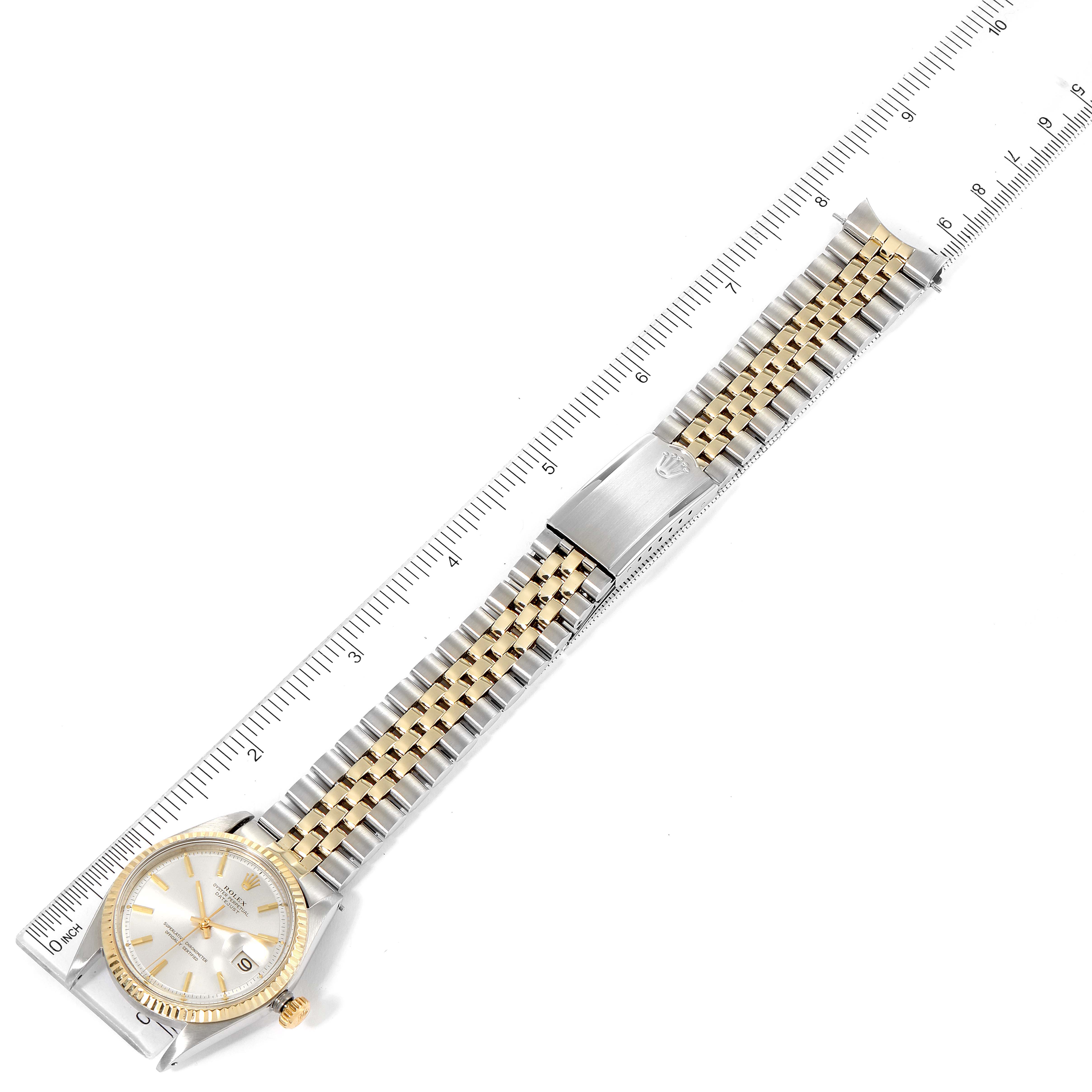 The image shows an overhead view of the Rolex Vintage Collection 1601 Men's Steel and Gold (two tone) Silver Dial 1601 Men's Steel and Gold (two tone) Silver Dial watch, displaying the full watch face, bezel, and bracelet with ruler measurements.