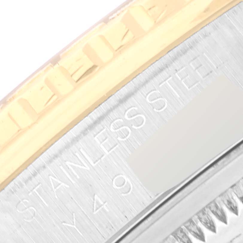 This image shows a close-up of the edge and the "Stainless Steel" engraving on the case of a Rolex Turn-o-Graph 16263 Men
s Steel and Gold (two tone) White Dial 16263 Men
s Steel and Gold (two tone) White Dial watch.