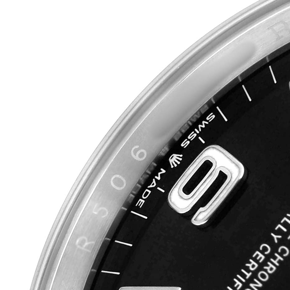 This image shows a close-up of the Rolex Explorer 124270 Men's Stainless Steel Black Dial watch, focusing on the bezel, part of the dial, and the numeral 9.