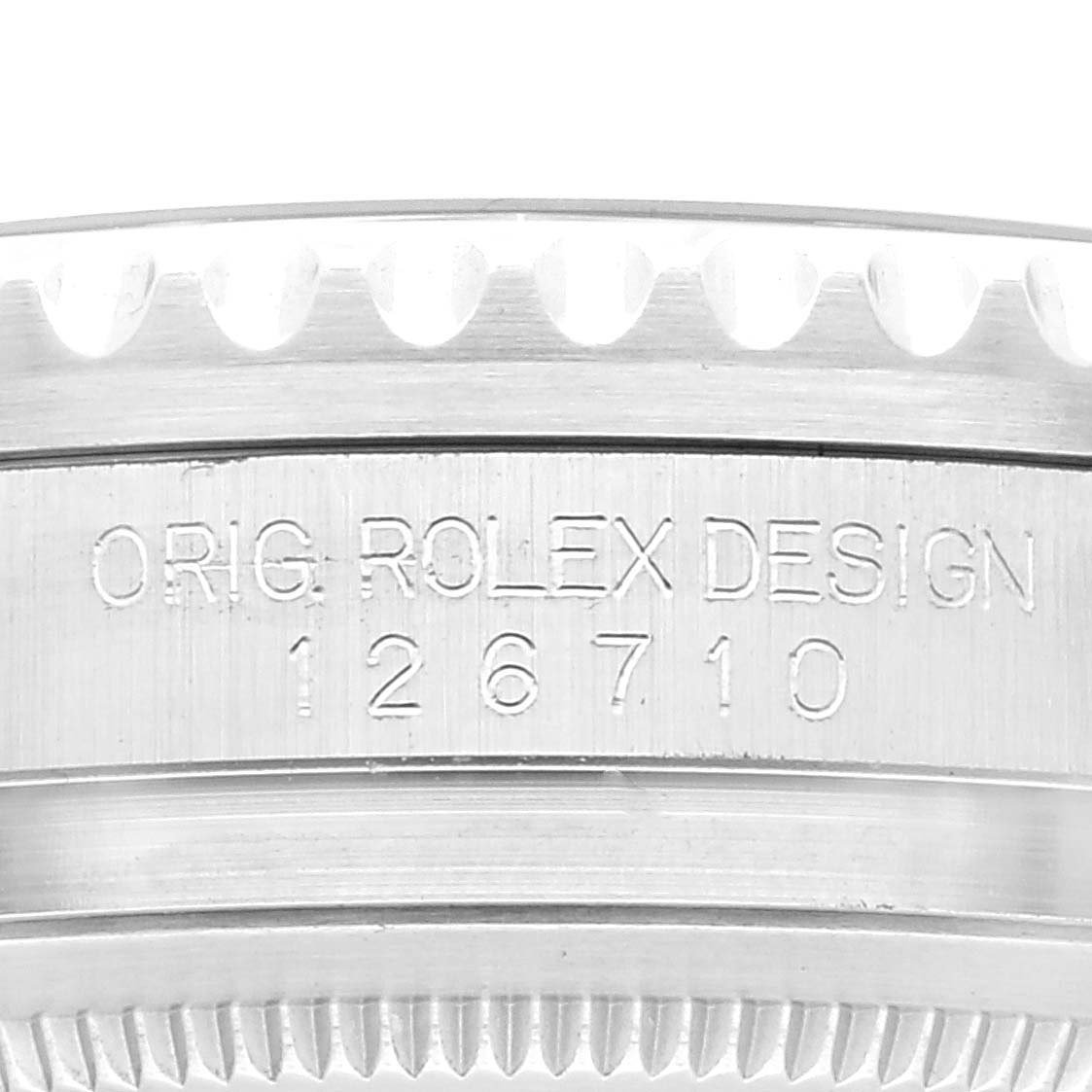 This image shows a close-up of the case engraving and bezel edge of a Rolex GMT-Master 126710 Men's Stainless Steel Black Dial 126710 Men's Stainless Steel Black Dial, including the model number 126710.