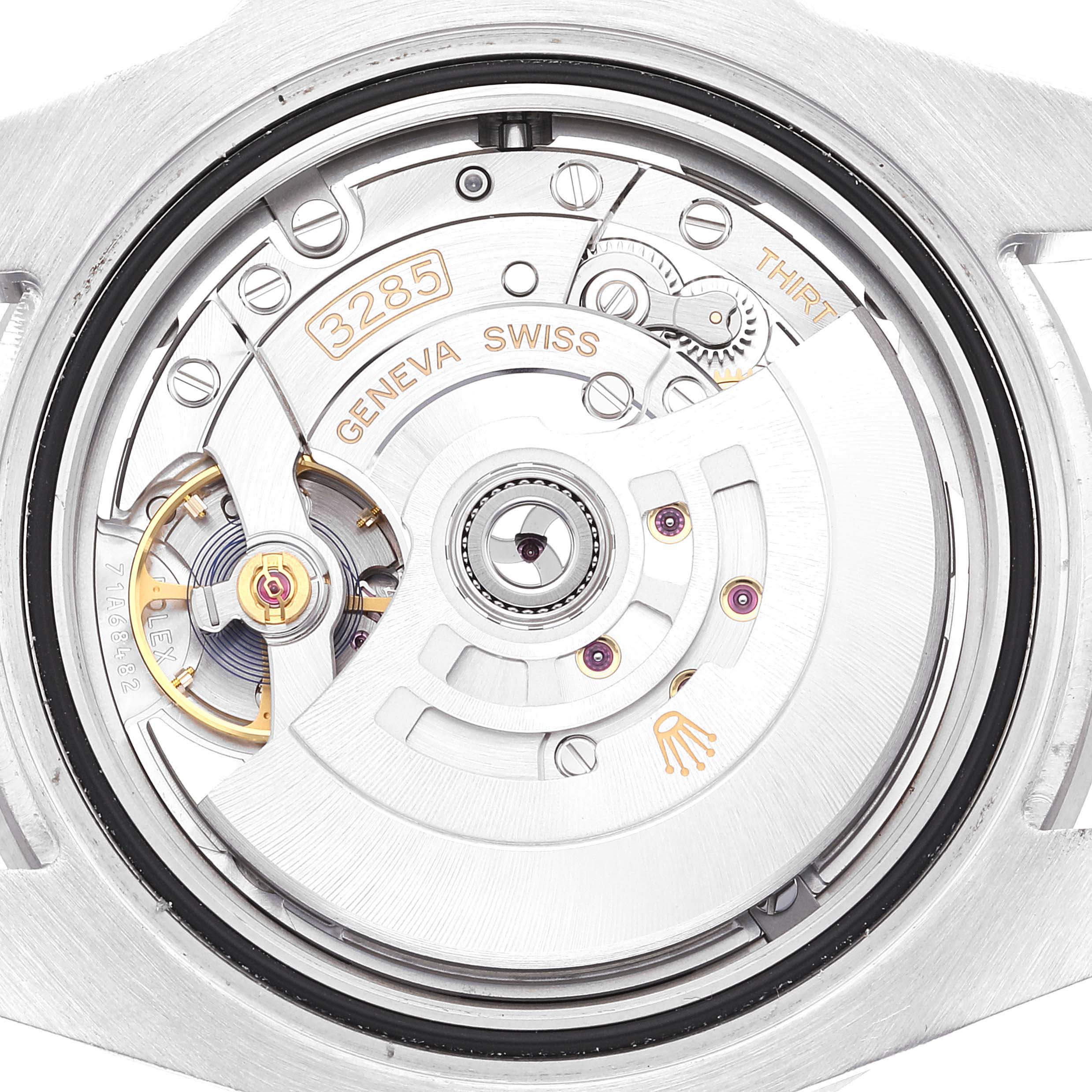 This image shows a close-up view of the movement mechanism of a Rolex GMT-Master 126710 Men's Stainless Steel Black Dial 126710 Men's Stainless Steel Black Dial watch.