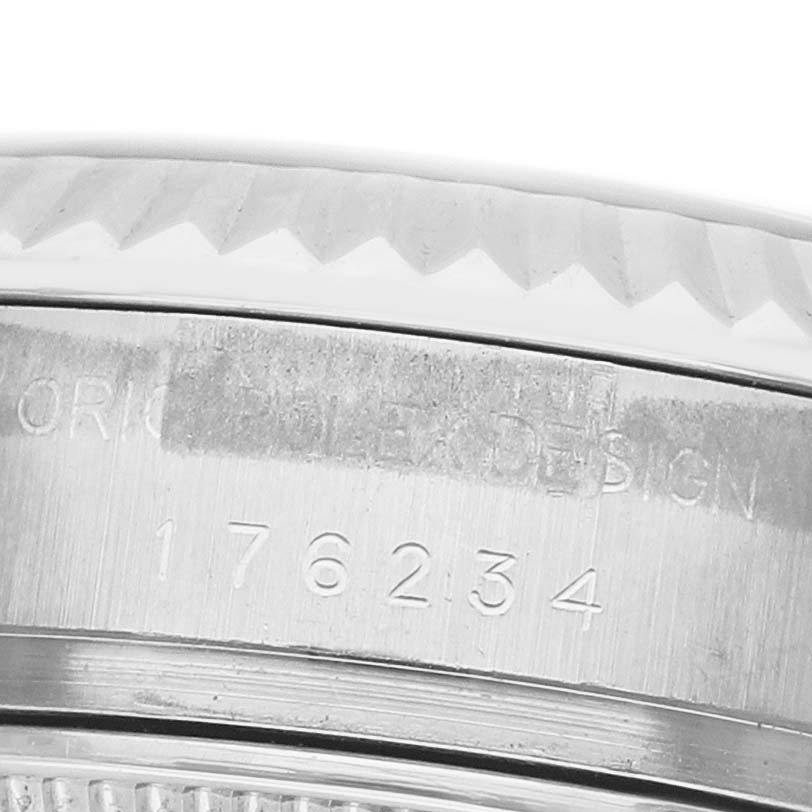 The image shows a close-up of the side case of a Rolex Oyster Perpetual 176234 Women's Stainless Steel Black Dial watch, highlighting the serial engraving and bezel detail.