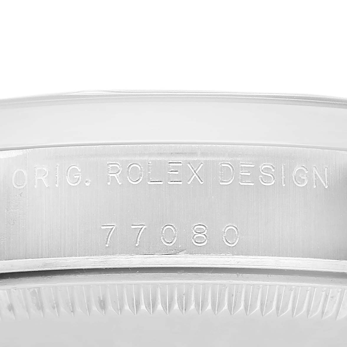 The image shows the side profile of a Mid-Size Rolex watch case, featuring engraved model and design number details.