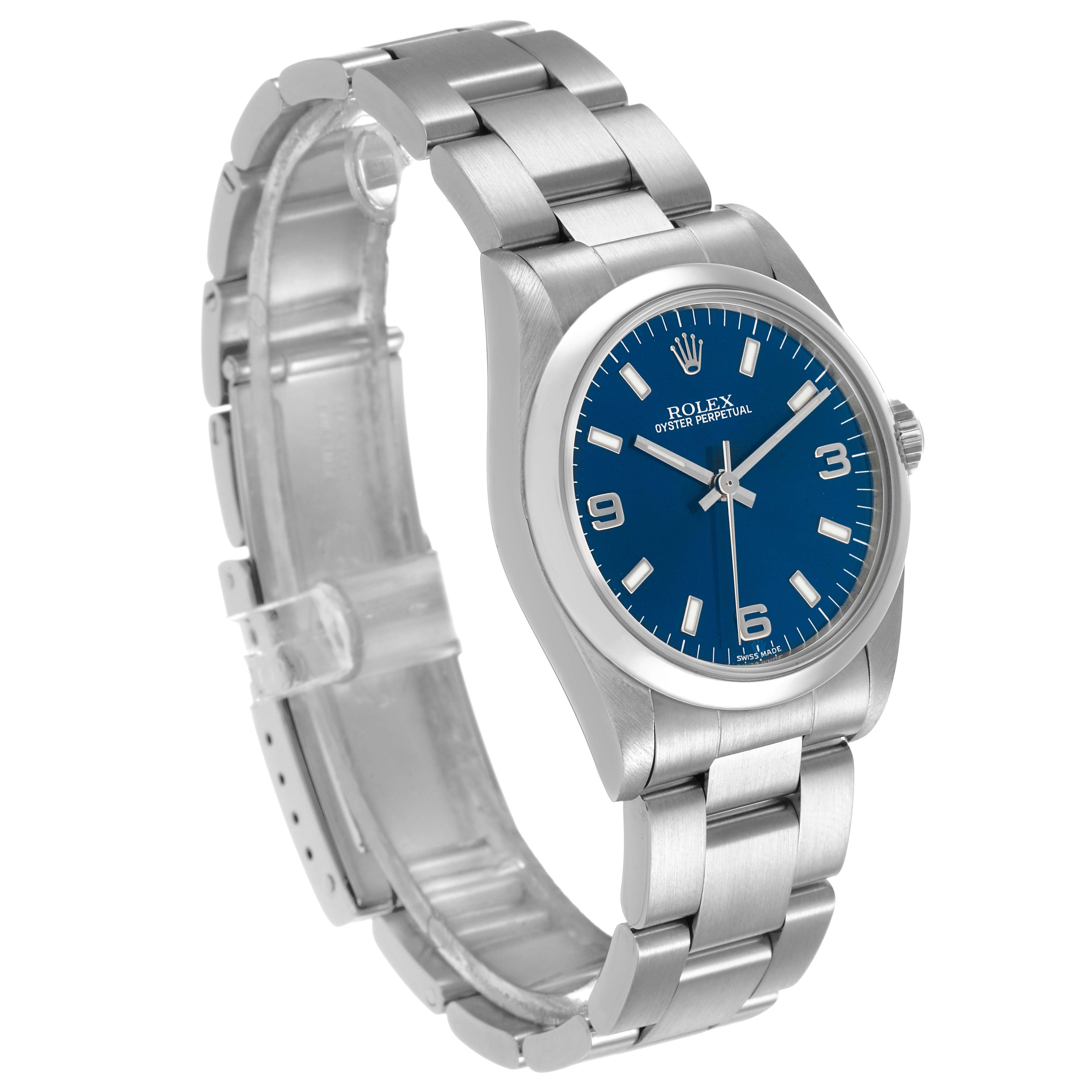 The Rolex Mid-Size 77080 Women's Stainless Steel Blue Dial watch is shown at a three-quarter angle, displaying the face, bezel, and part of the bracelet.
