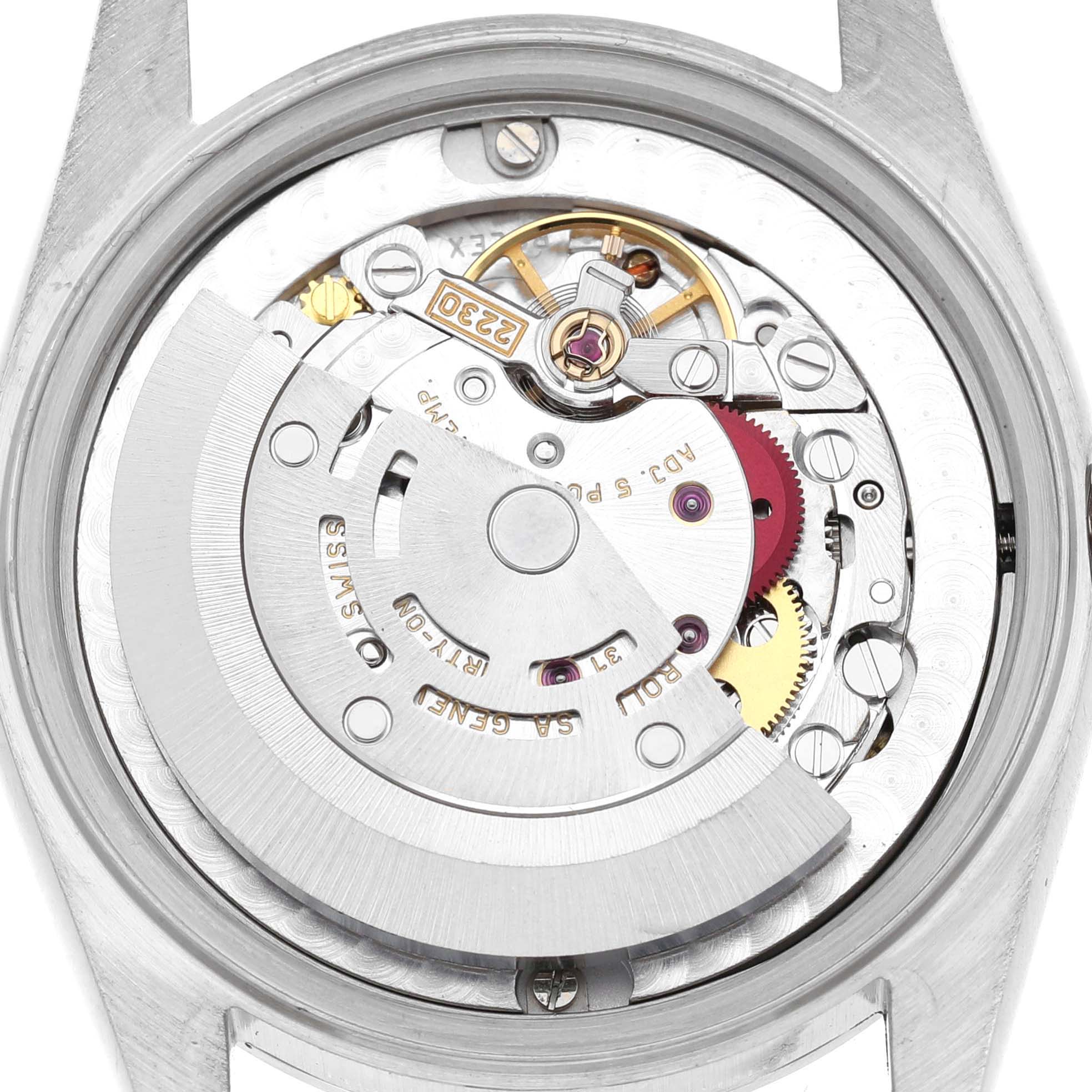 The image shows the movement of a Rolex Mid-Size 77080 Women's Stainless Steel Blue Dial model watch from the back, highlighting gears and the rotor.