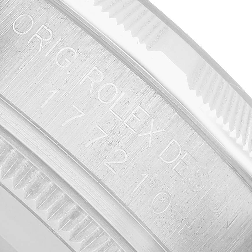 The image shows a close-up of the engraved side of a Rolex Mid-Size 177210 Women's Stainless Steel Pink Dial model, highlighting the bezel’s teeth.
