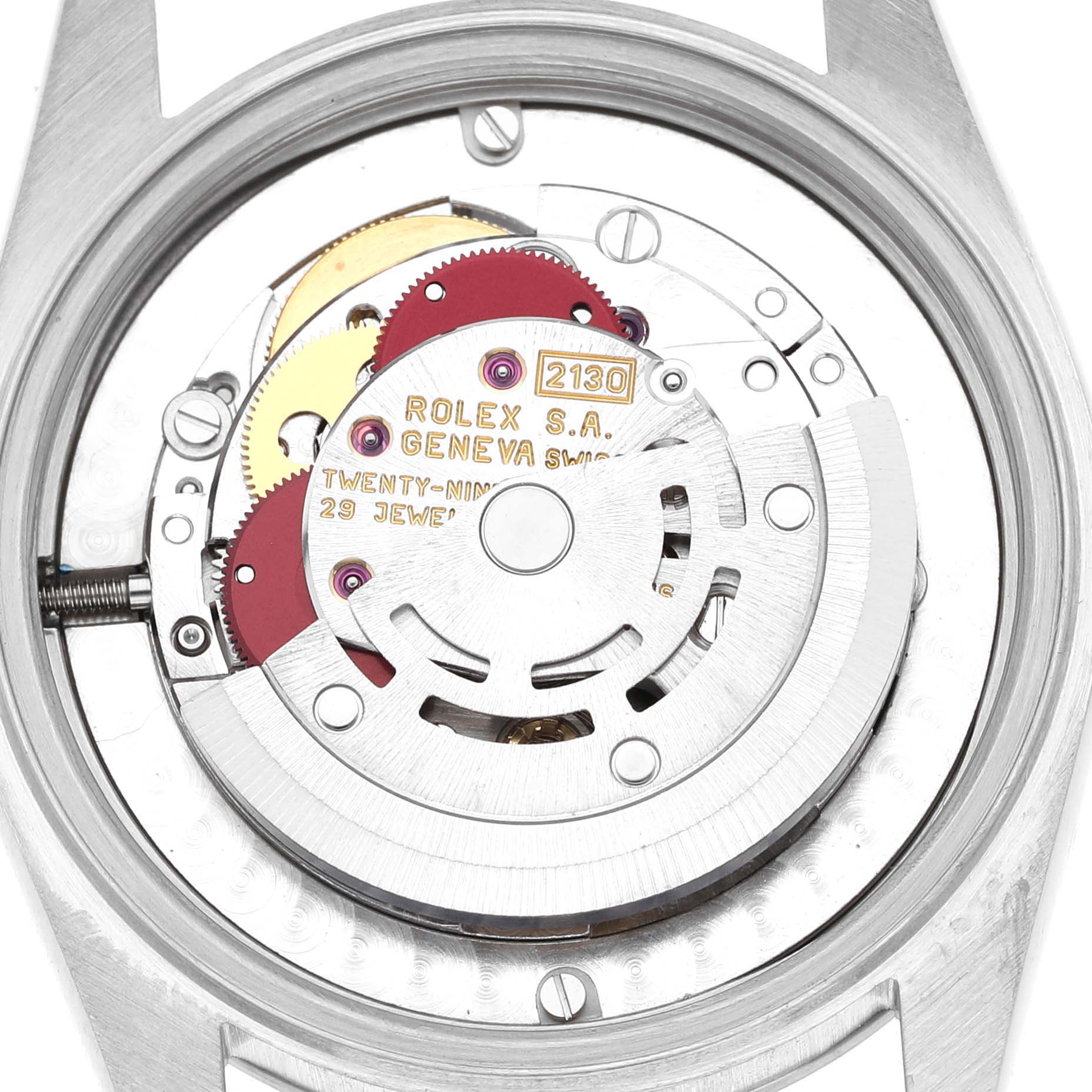 The image shows the movement of a Mid-Size Rolex watch from a back angle, revealing gears and the rotor mechanism.
