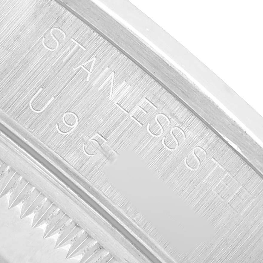 The image shows a close-up of the inner case back engraving on a Rolex Date 15200 Men's Stainless Steel White Dial model watch, highlighting "STAINLESS STEEL."