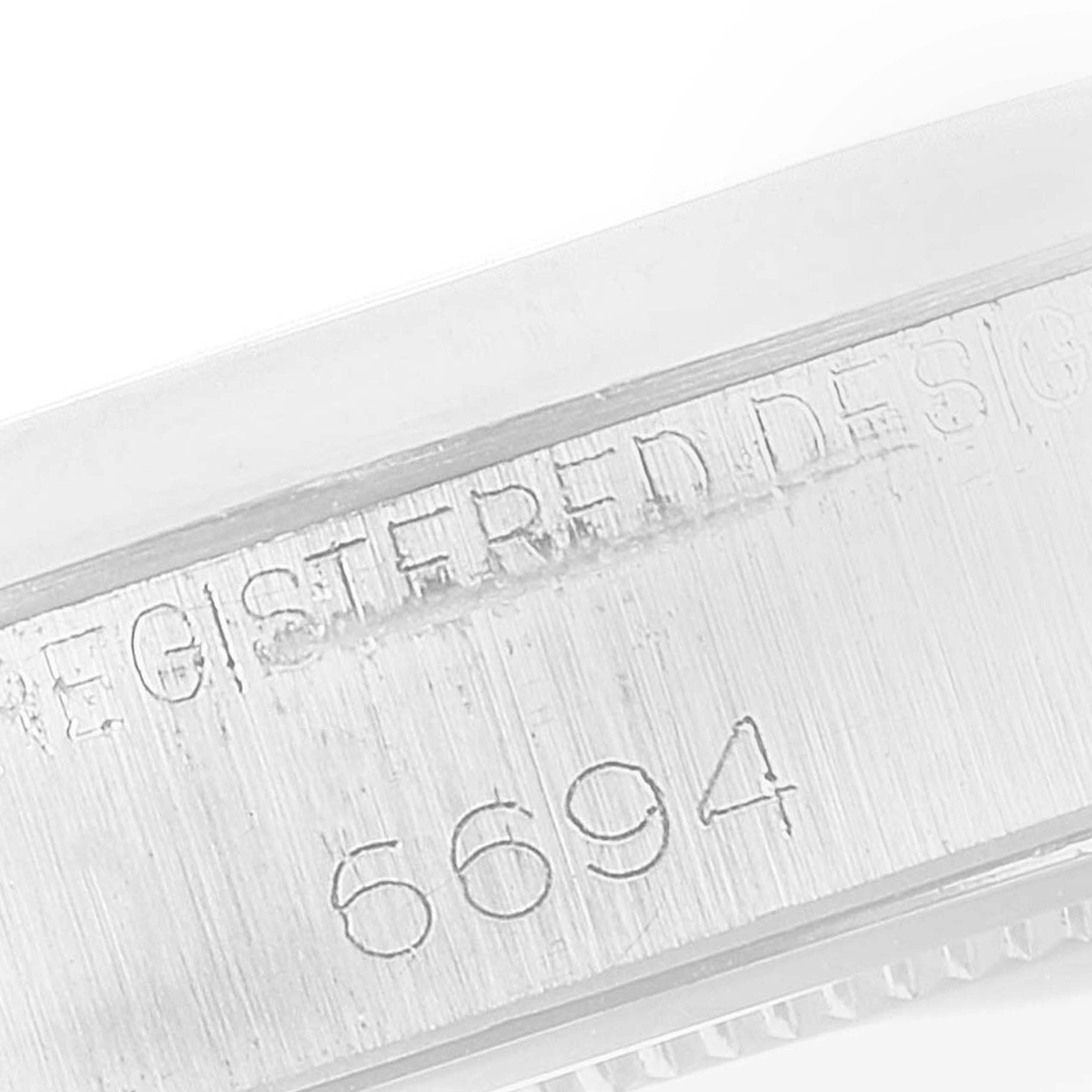 This is a close-up angle showing the engraved model number "6694" on the case side of the Rolex Vintage Collection 6694 Men
s Stainless Steel Silver Dial 6694 Men
s Stainless Steel Silver Dial watch.