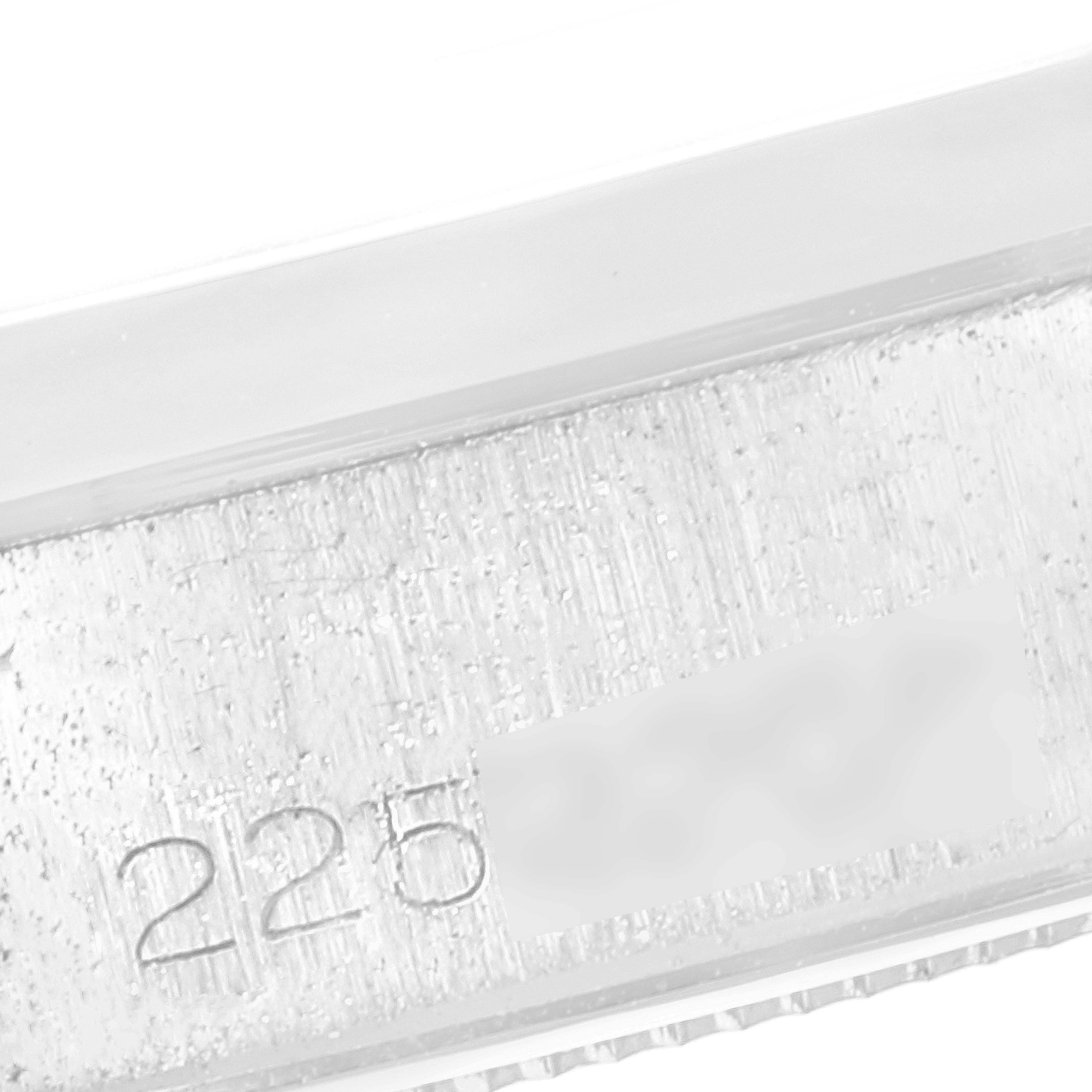 The image shows a close-up of the engraved inner bezel of a Vintage Collection model by Rolex.