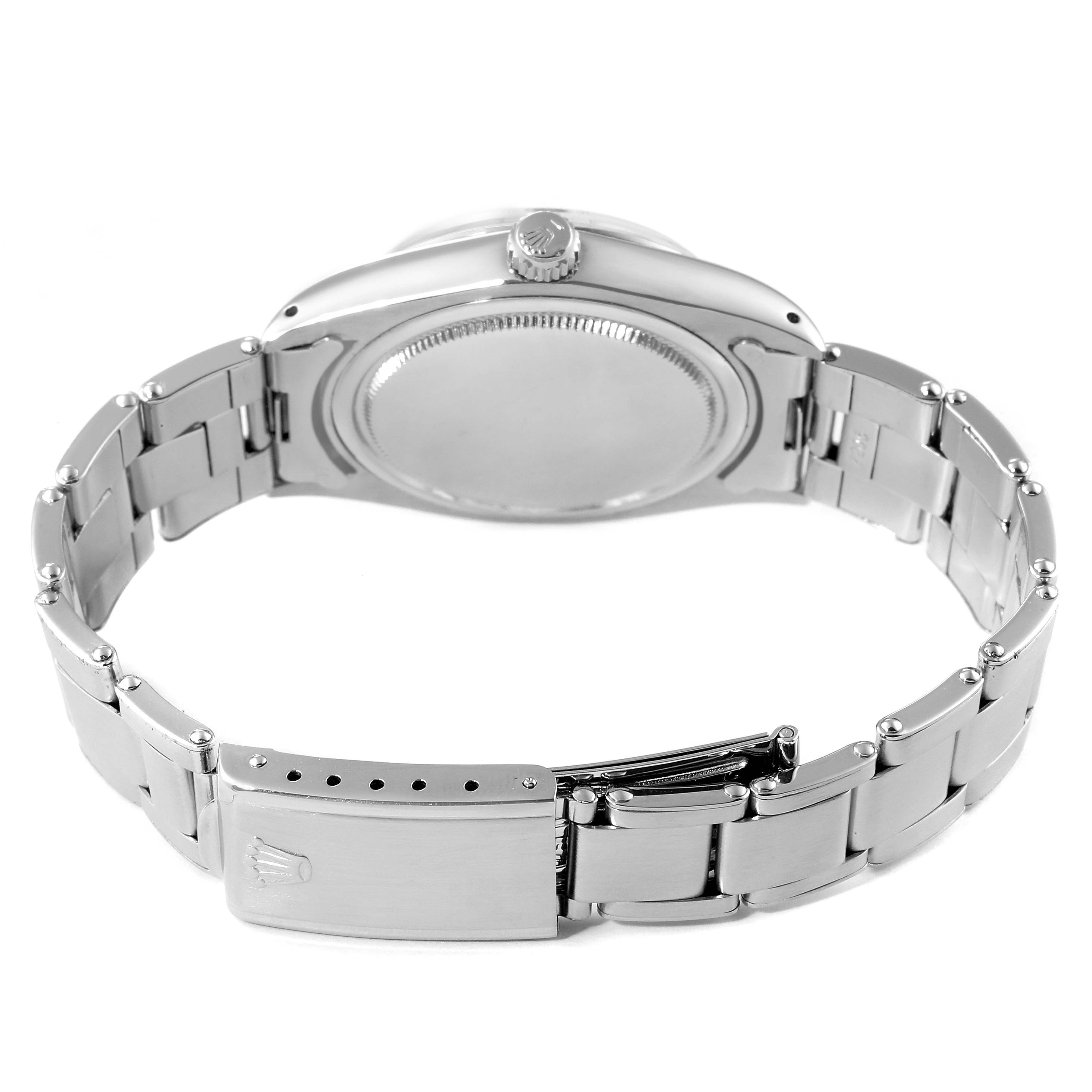 The image shows the back and bracelet of the Rolex Vintage Collection 6694 Men
s Stainless Steel Silver Dial 6694 Men
s Stainless Steel Silver Dial watch, highlighting its clasp and crown.