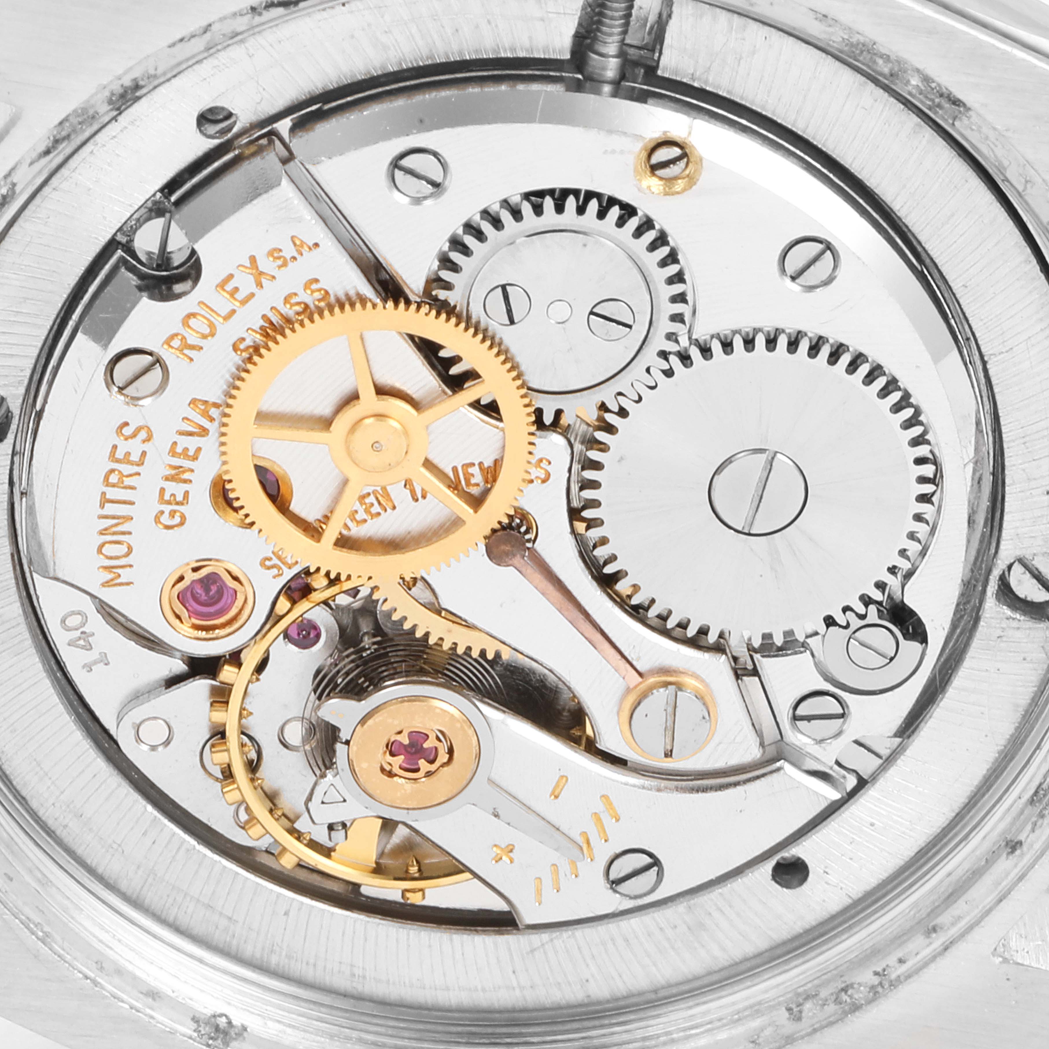 The image shows the internal mechanism and gears of a Rolex Vintage Collection 6694 Men's Stainless Steel Champagne Dial 6694 Men's Stainless Steel Champagne Dial model watch.