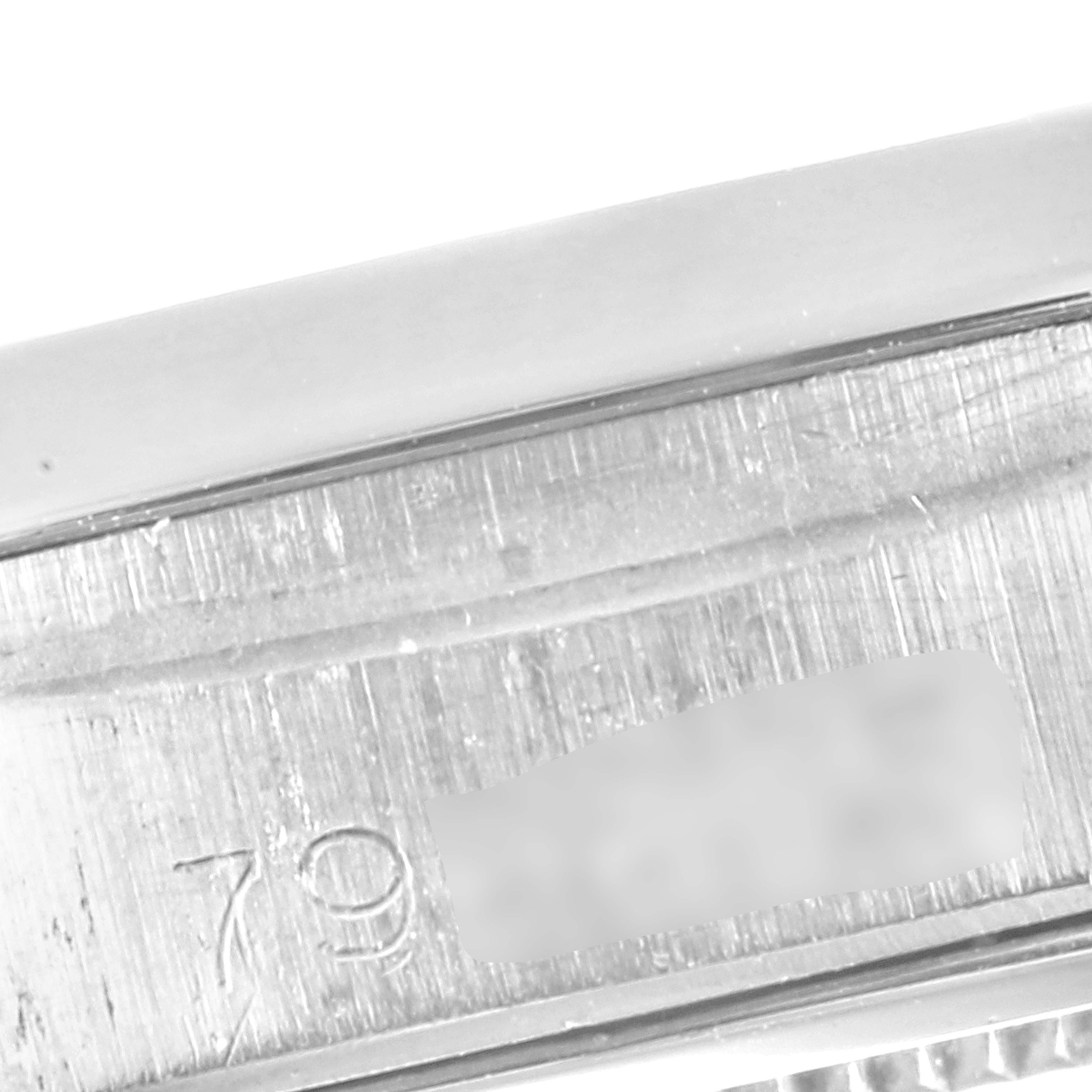 This image shows a close-up of the case side with engraved serial numbers of a Vintage Collection Rolex watch.