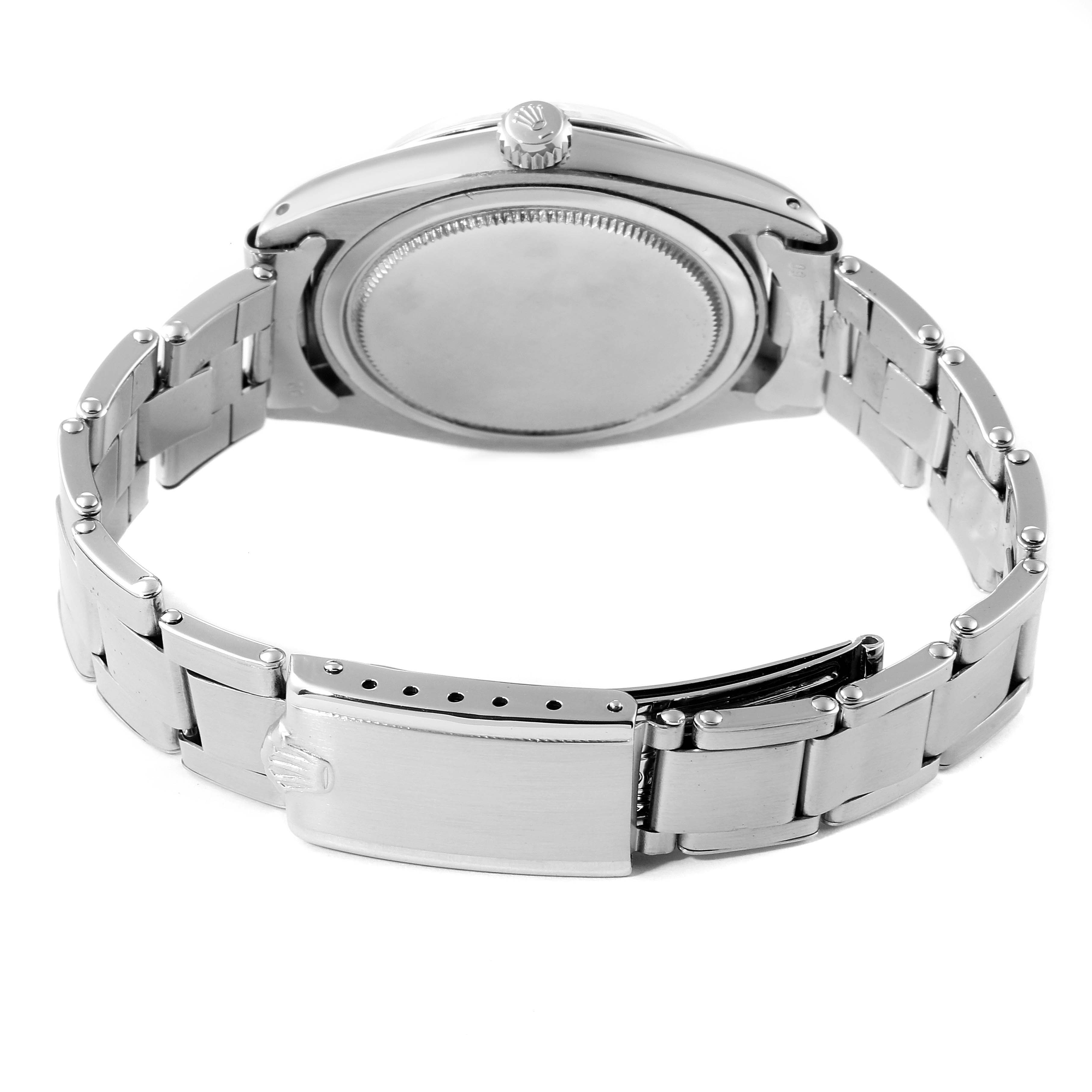 The image shows the backside and bracelet of a Rolex Vintage Collection 6694 Men's Stainless Steel Champagne Dial 6694 Men's Stainless Steel Champagne Dial watch, highlighting its clasp and case back.