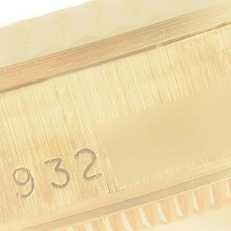 The image shows a close-up of the serial number area on the case of a Rolex President 68278 Women
s Yellow Gold Champagne Dial 68278 Women
s Yellow Gold Champagne Dial model watch.
