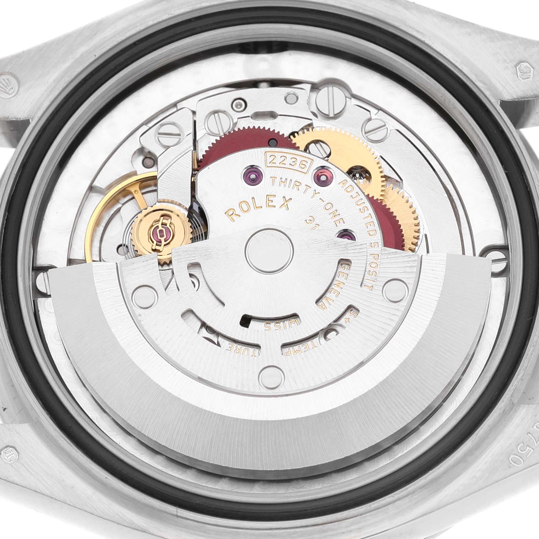 The image shows the movement mechanism of the Rolex President 278289 Women's White Gold Blue Dial watch from the back, highlighting the intricate gears and rotor.