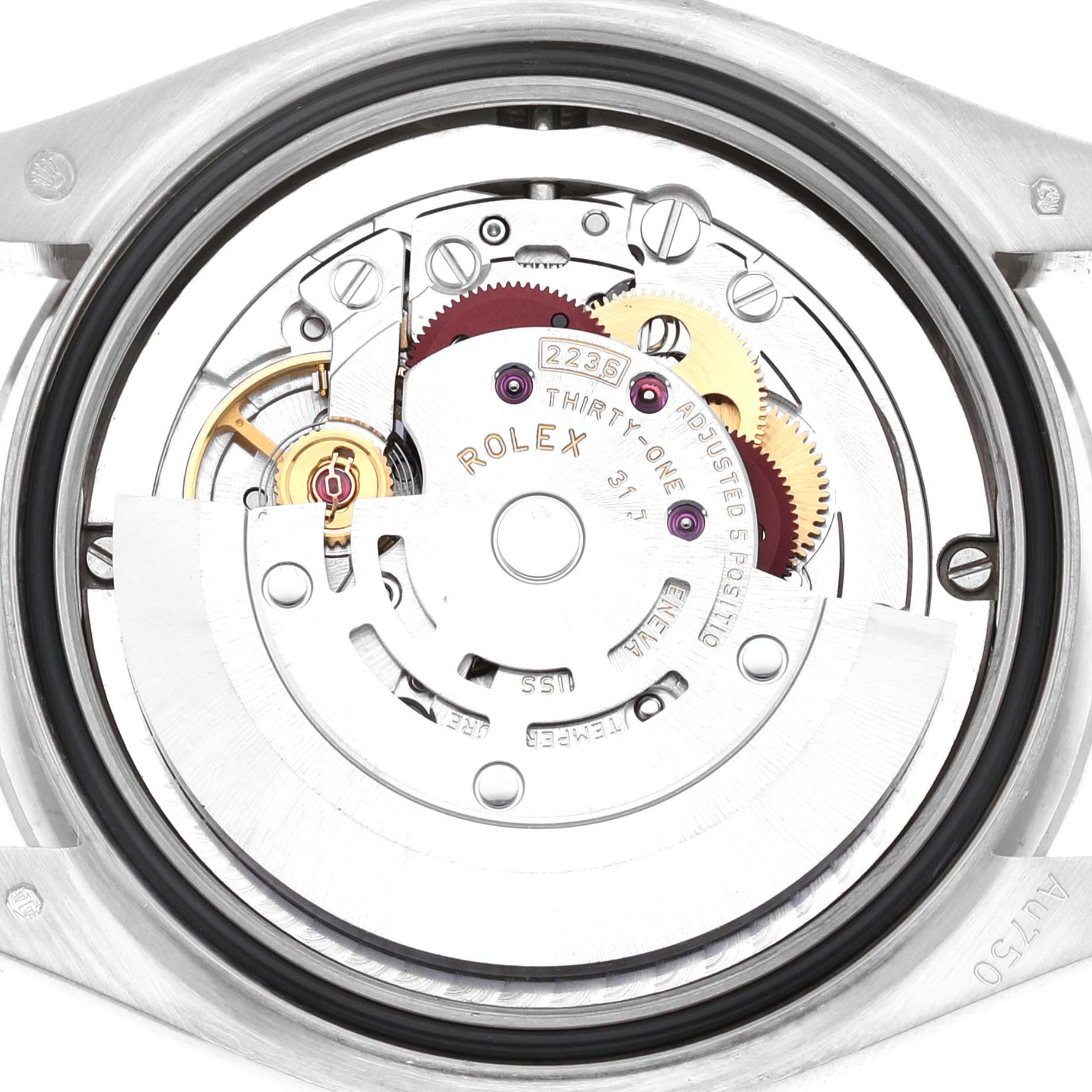 The image shows the internal movement of a Rolex Mid-Size 278289 Women's White Gold Mother of Pearl Dial model from a top-down angle, revealing gears and mechanical components.